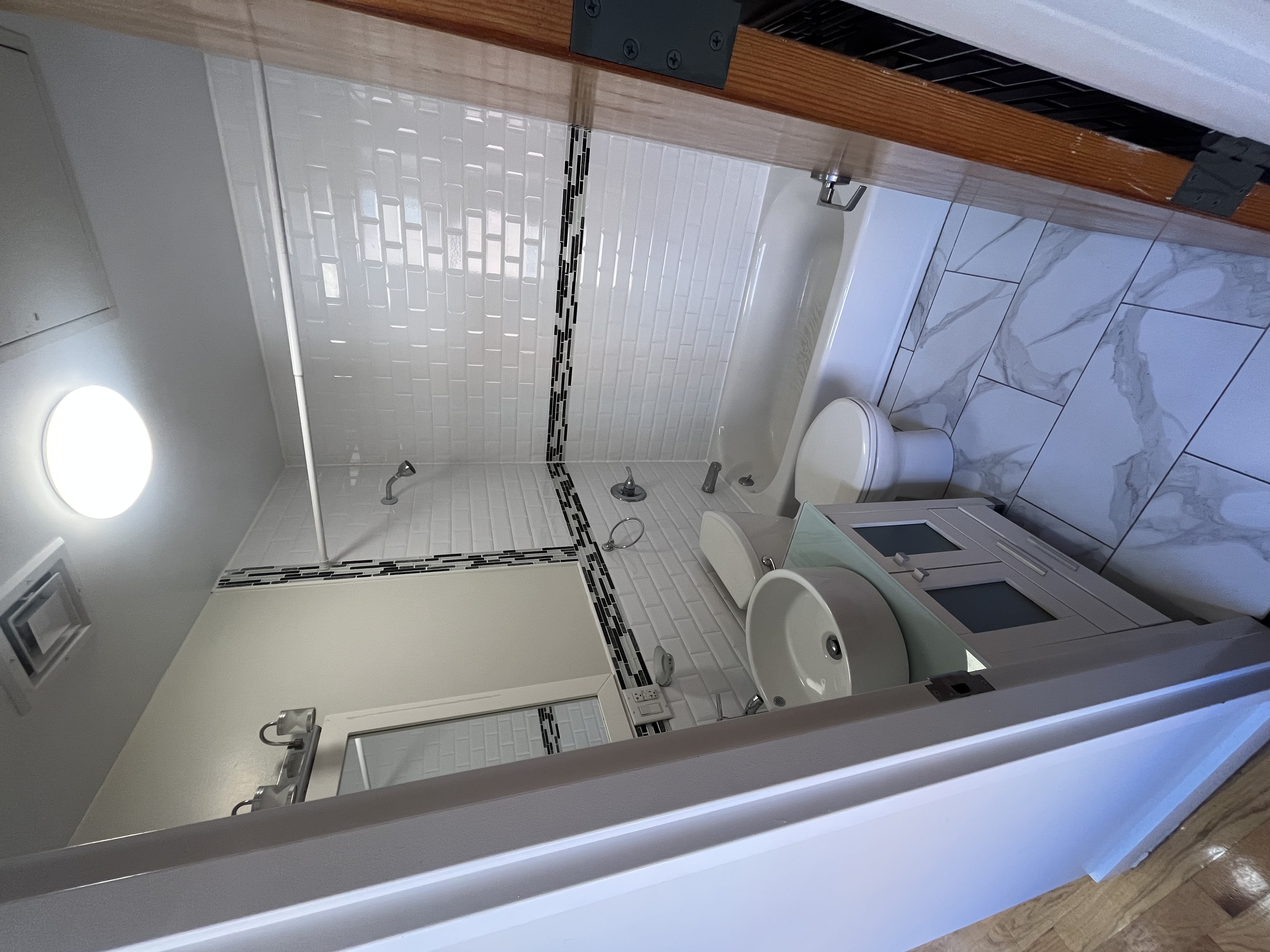 610 Monroe Street, Unit 2R Brooklyn, NY 11221 - Photo 6 of 6 a bathroom with a toilet a sink and shower