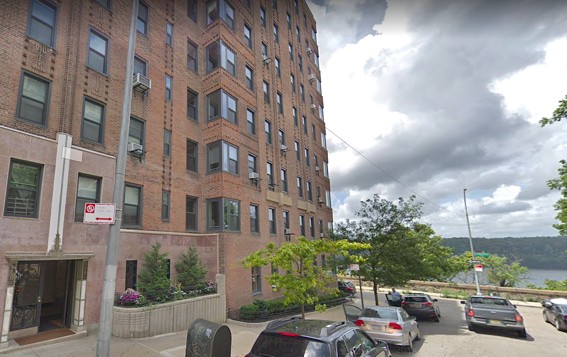 250 Cabrini Boulevard, Unit 1H Manhattan, NY 10033 - Photo 9 of 17 a city street lined with lots of tall buildings