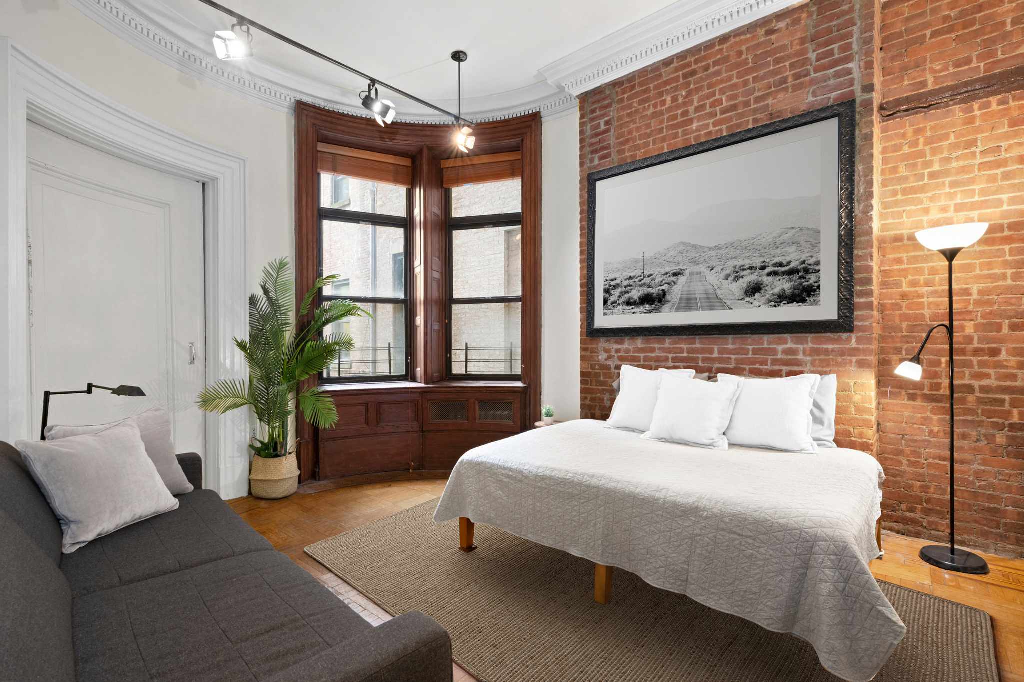 293 Riverside Drive, Unit 2B Manhattan, NY 10025 - Photo 1 of 6 a bedroom with a large bed and a large window