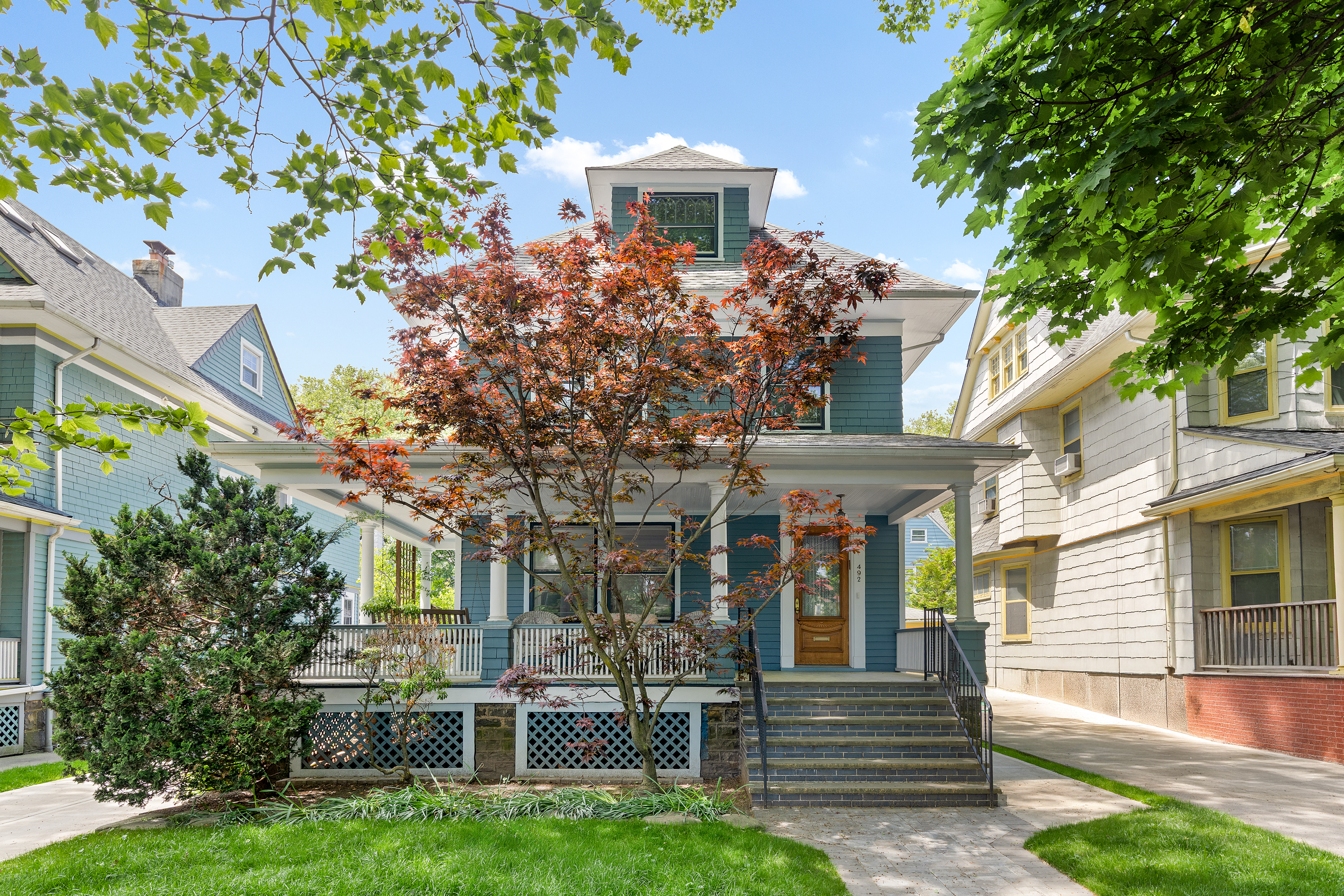 a front view of a house with garden