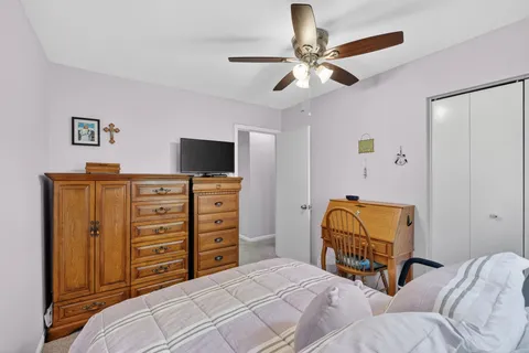a bathroom with a sink mirror and toilet