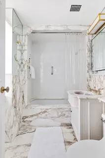 a bathroom with a sink and shower