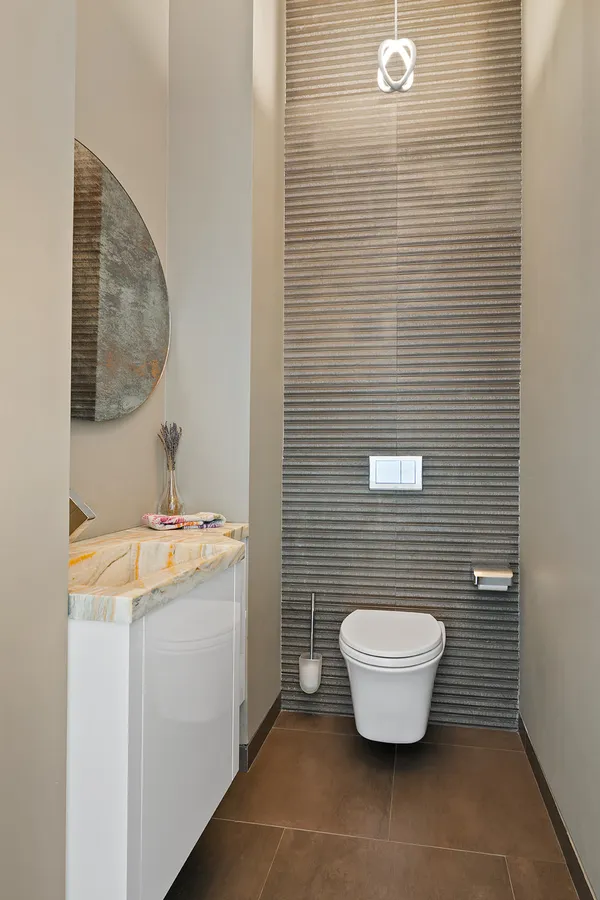 a bathroom with a toilet and a sink