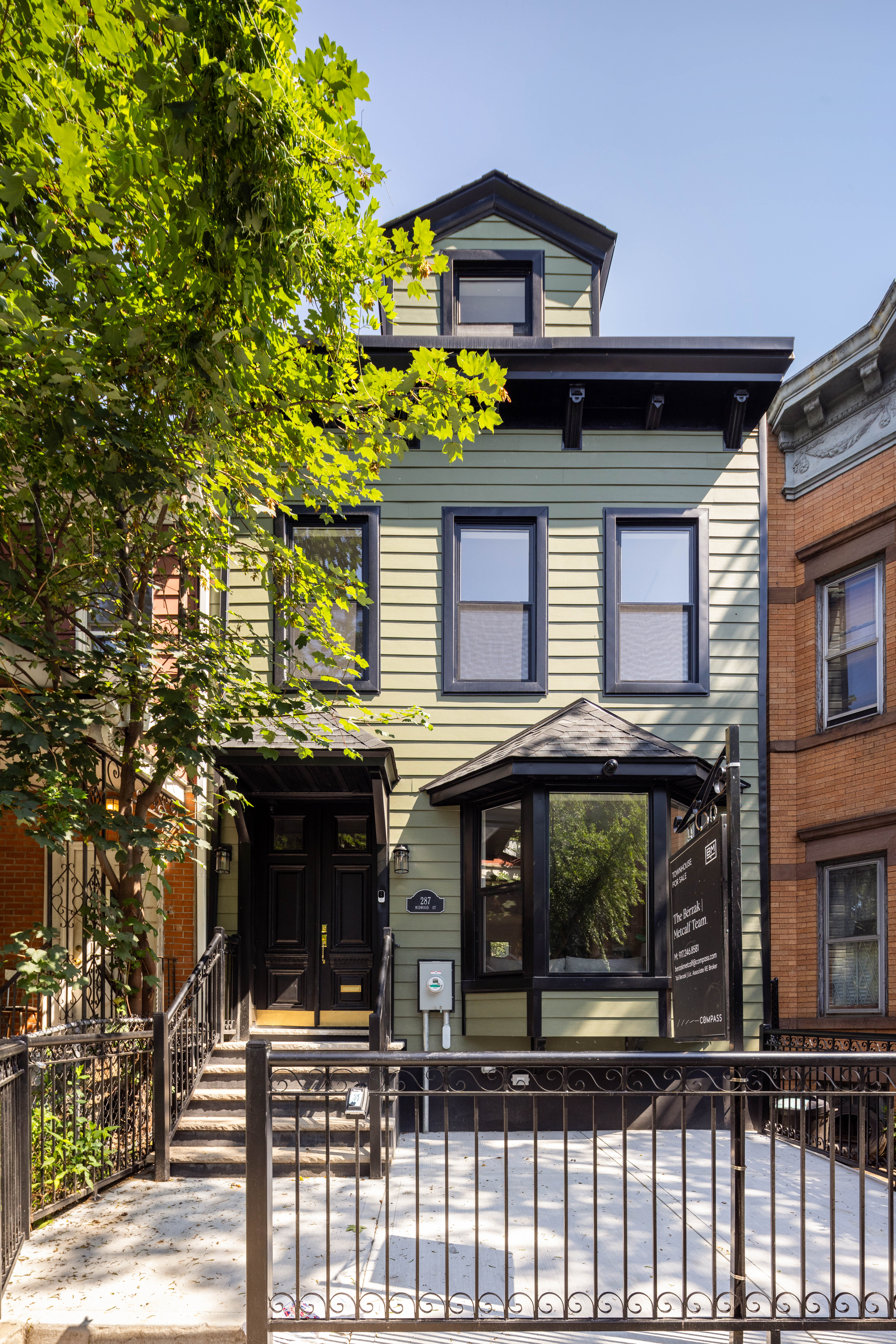 287 Midwood Street Brooklyn, NY 11225 - Photo 15 of 17 a front view of a house with glass windows