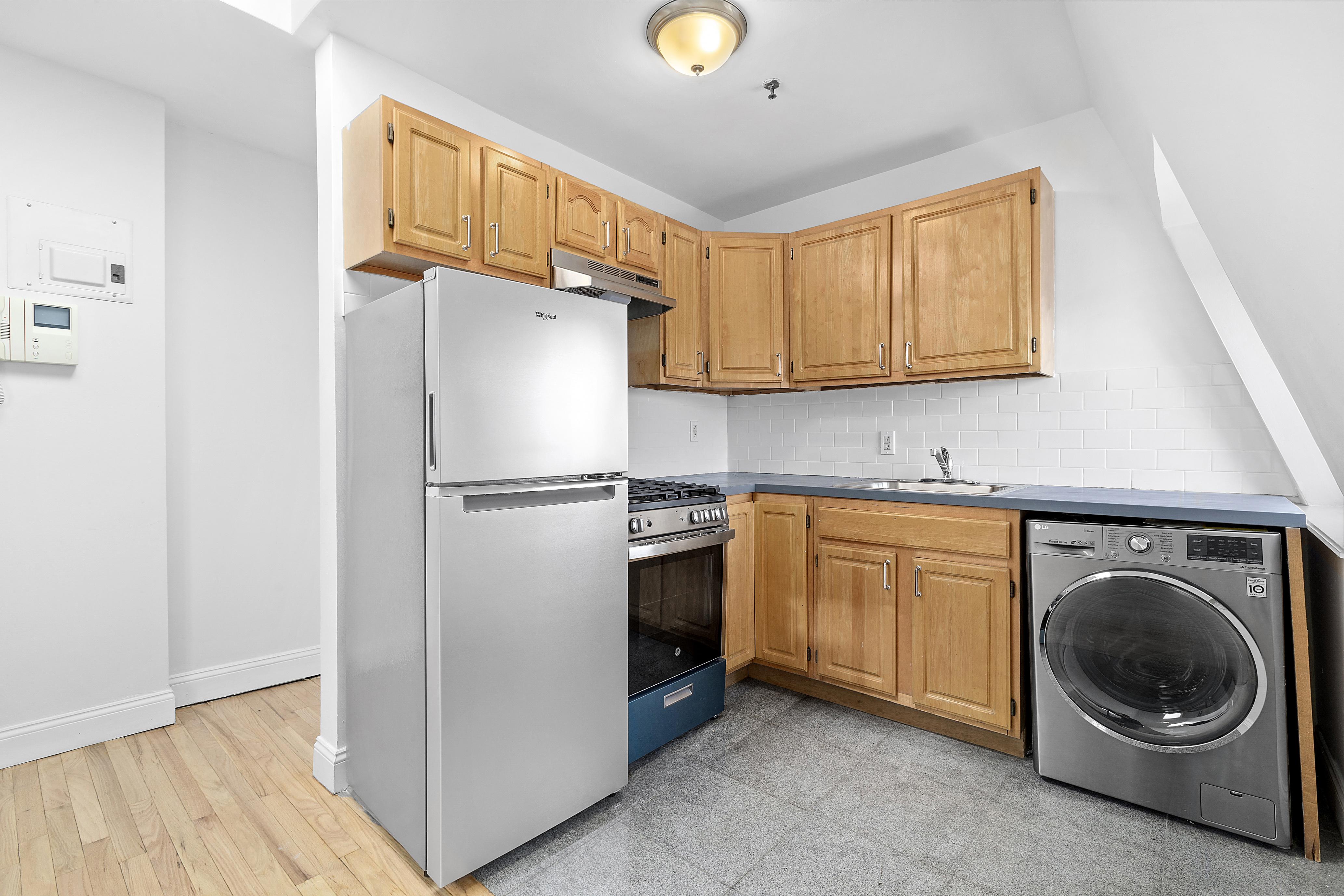 336 Convent Avenue, Unit MLTFMLY Manhattan, NY 10031 - Photo 18 of 20 a kitchen with stainless steel appliances granite countertop a refrigerator a stove a sink and a cabinets