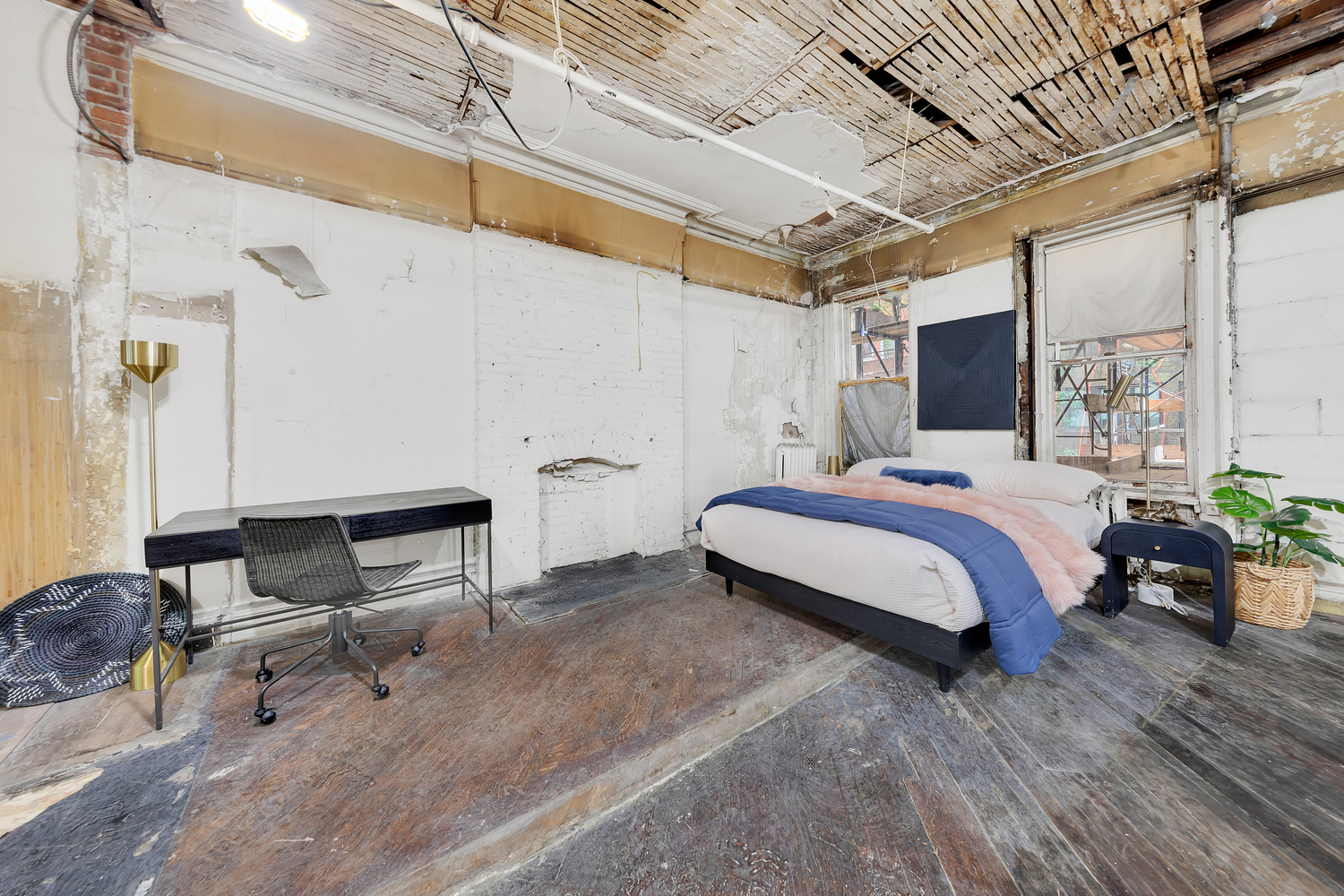 55 West 71st Street Manhattan, NY 10023 - Photo 6 of 11 a spacious bedroom with a bed and wooden floor