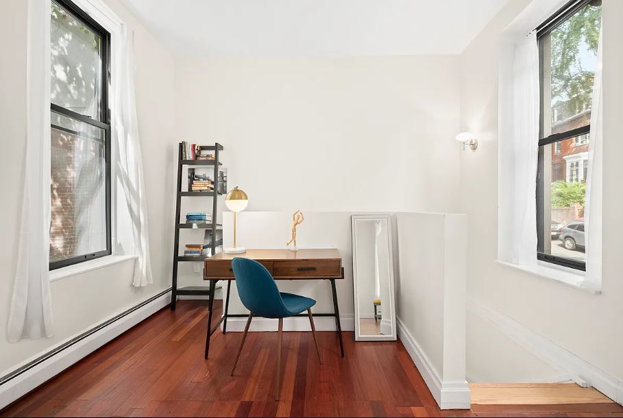 400 West 154th Street, Unit 1 Manhattan, NY 10032 - Photo 7 of 10 a workspace with furniture window and wooden floor