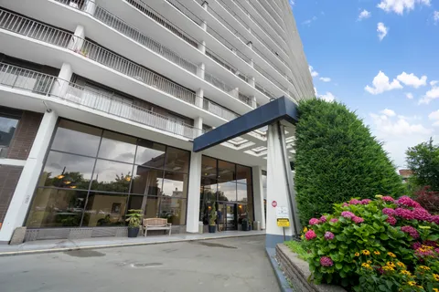 a view of a building with sitting area