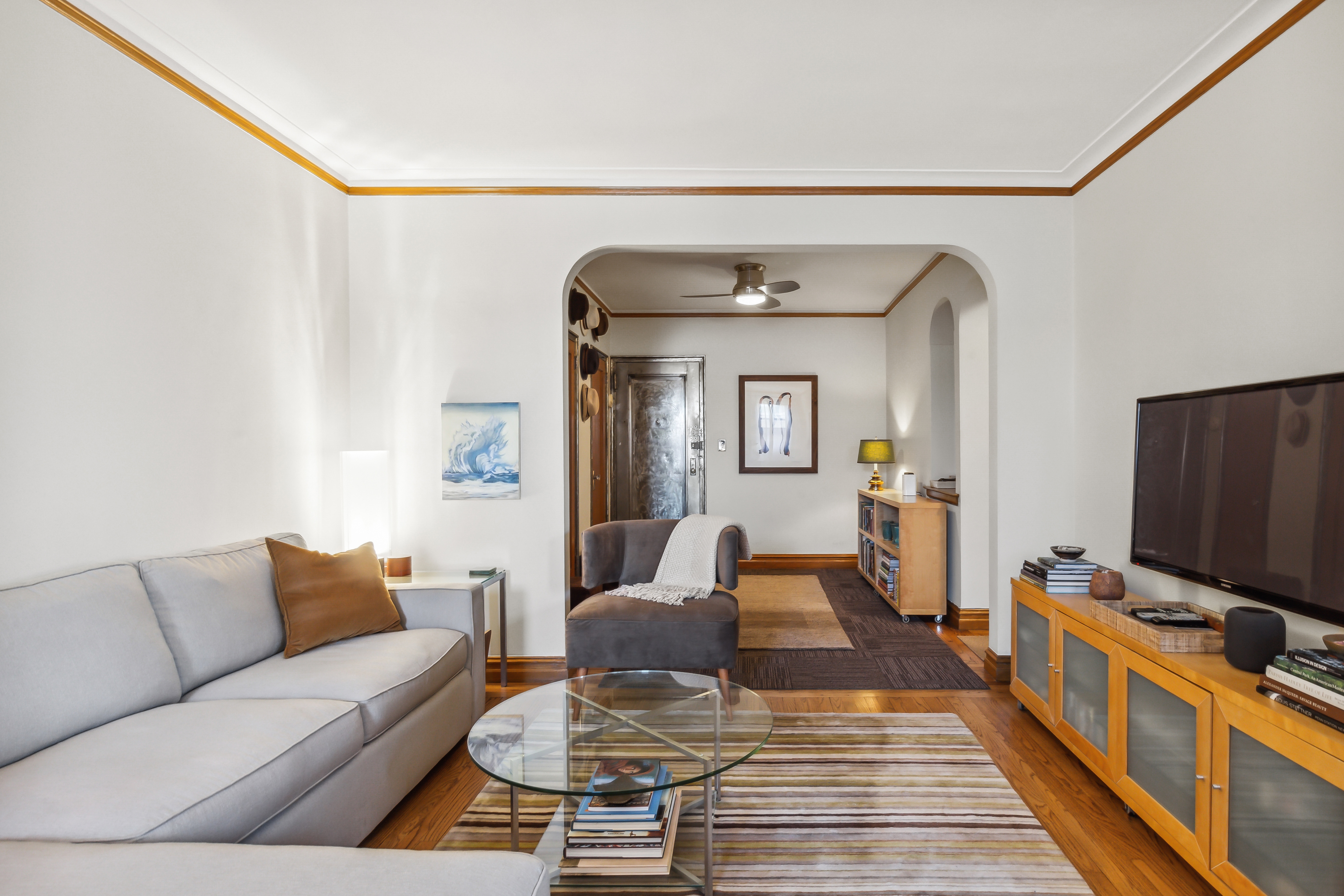 45 Park Terrace West, Unit 5A Manhattan, NY 10034 - Photo 3 of 22 a living room with furniture and a flat screen tv