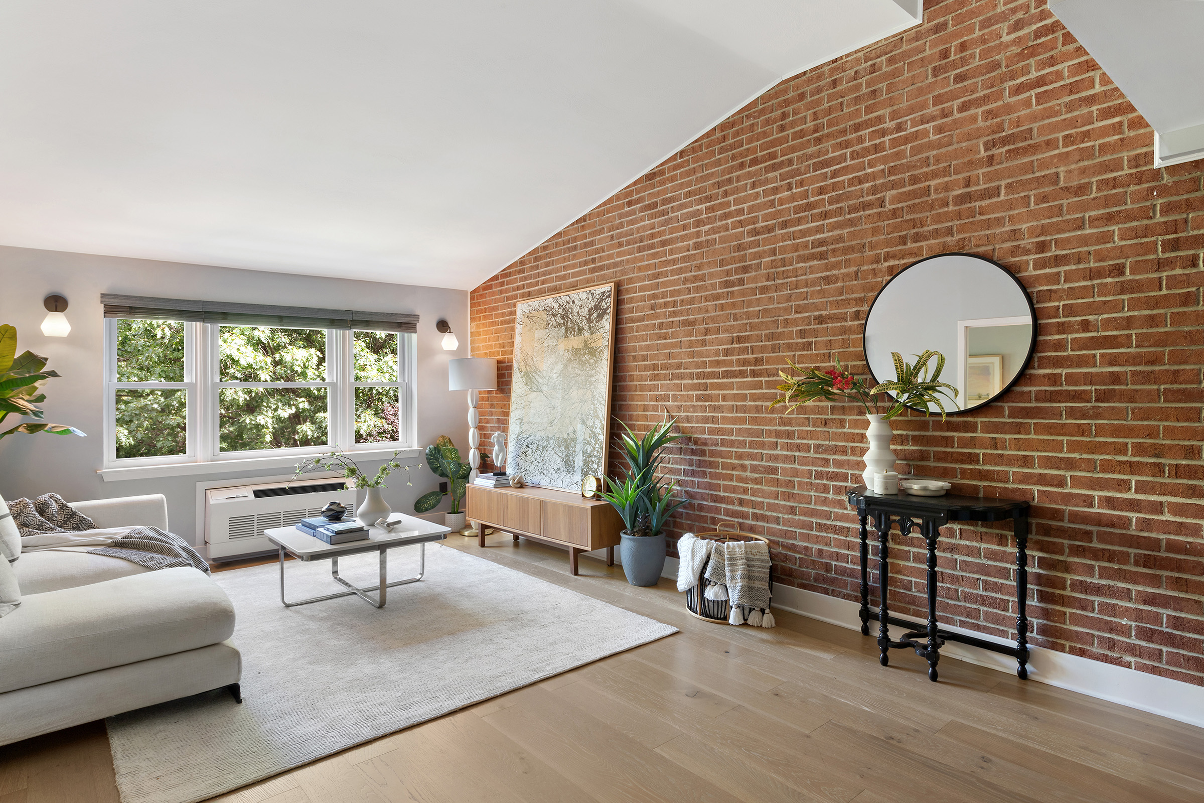 113 Prospect Park Southwest, Unit 12 Brooklyn, NY 11218 - Photo 3 of 13 a living room with furniture and a large window