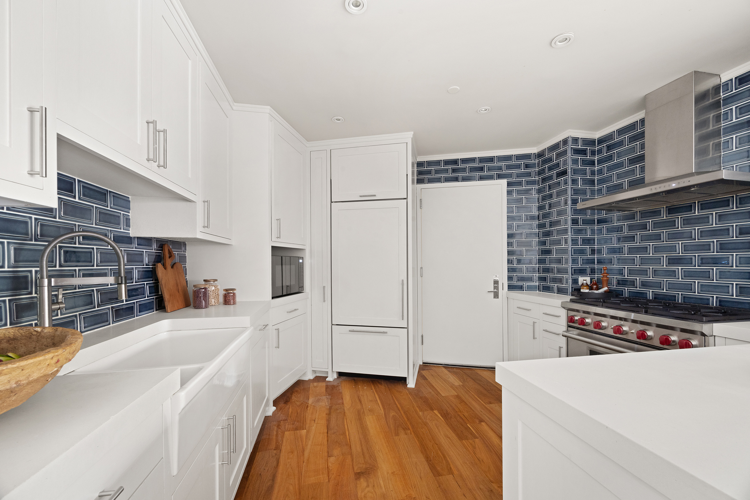 161 Duane Street, Unit 4B Manhattan, NY 10013 - Photo 7 of 16 a kitchen with a refrigerator and a stove top oven