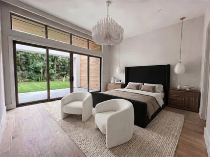 a bedroom with bed and a large window