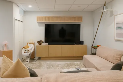 a living room with a couch and a flat screen tv
