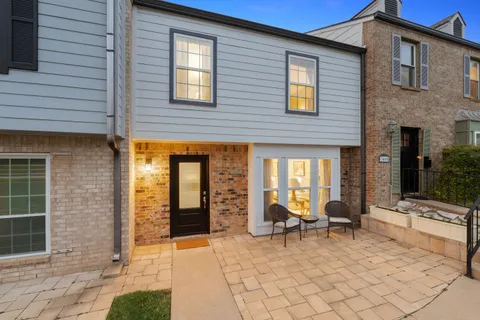 a swimming pool with outdoor seating and yard