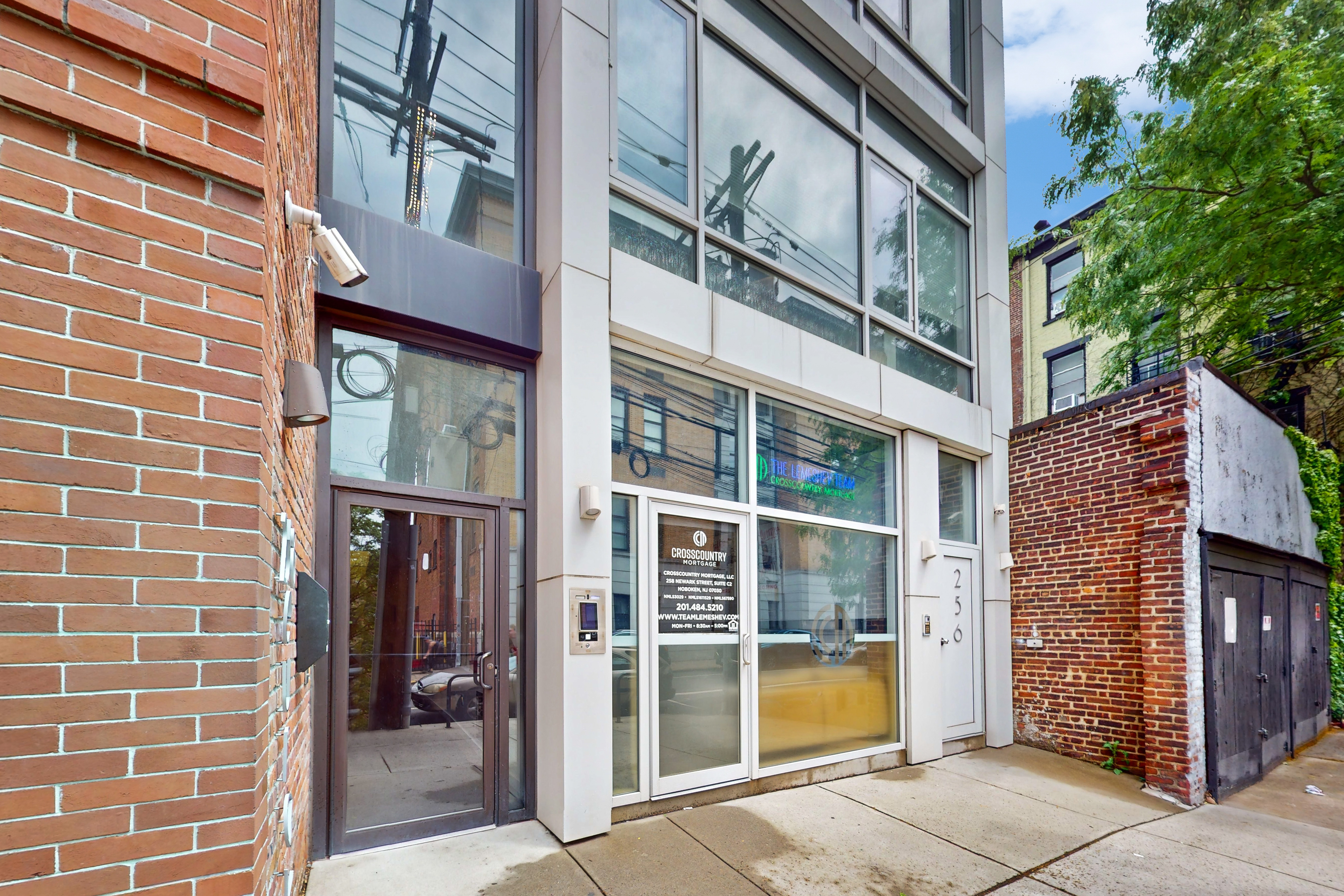258 Newark Street, Fl 4 Hoboken, NJ 07030 - Photo 25 of 35 a view of a brick building with a door and a window