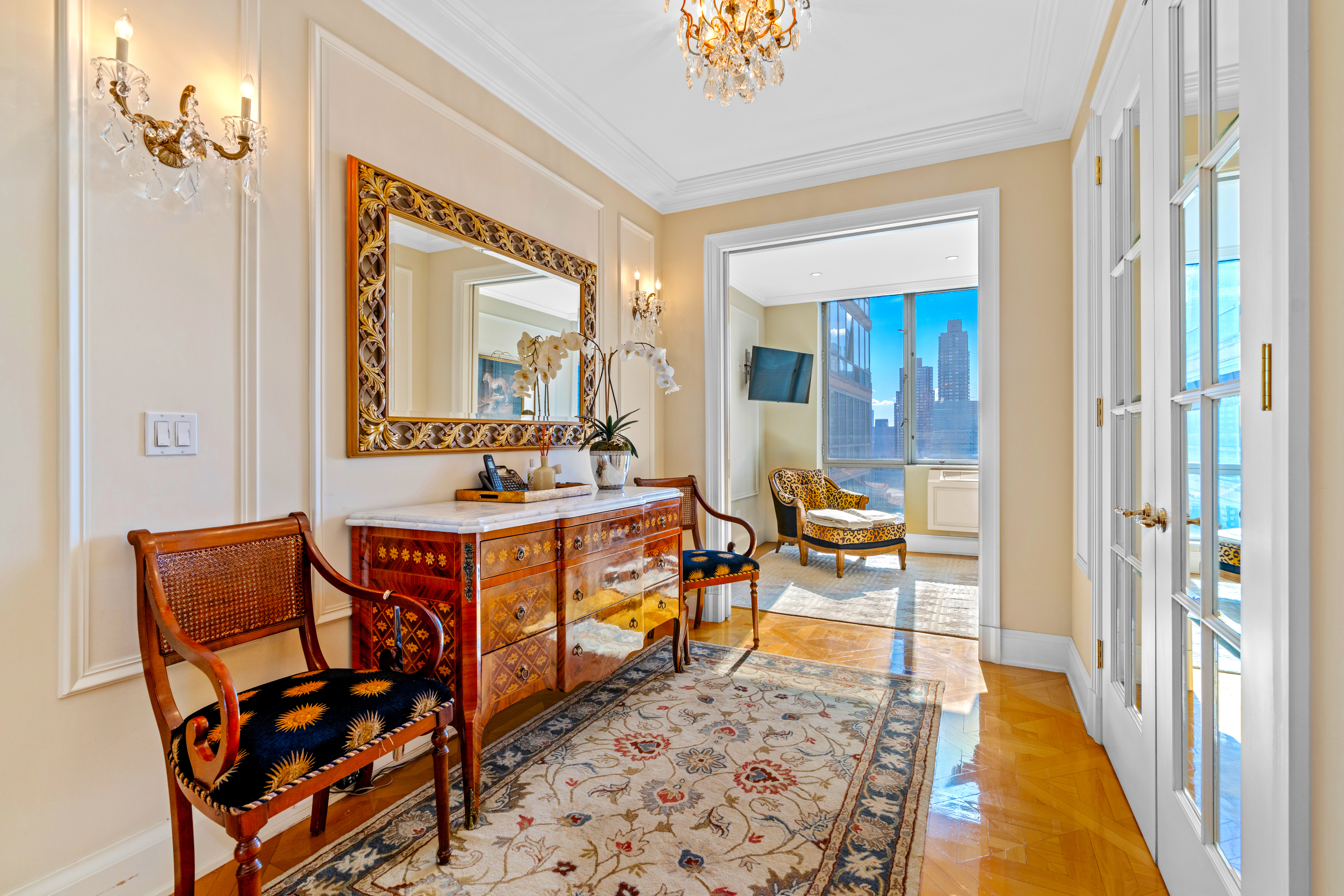 1965 Broadway, Unit 26EF Manhattan, NY 10023 - Photo 8 of 32 a living room with furniture a rug and a large window