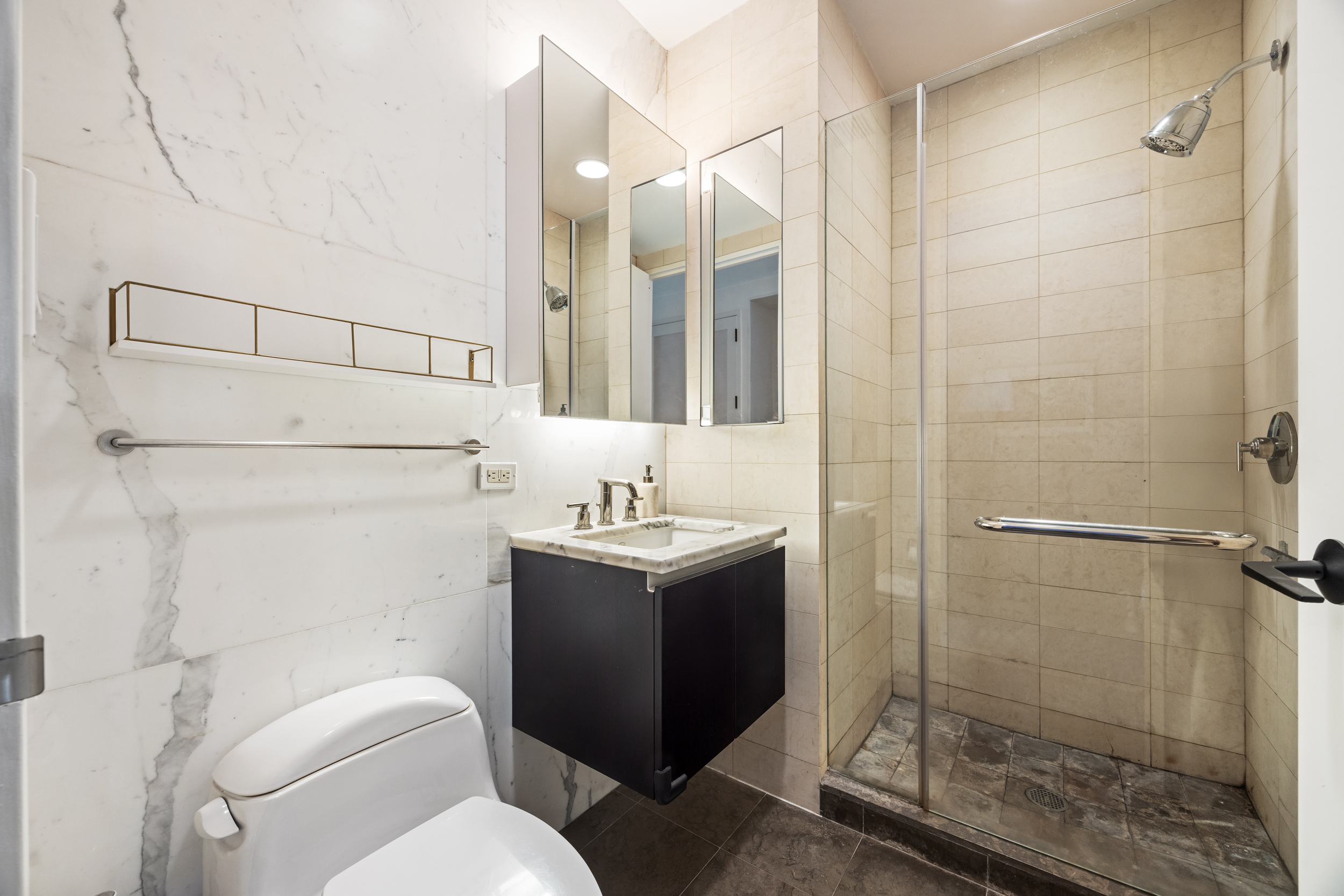 51 Walker Street, Unit 8B Manhattan, NY 10013 - Photo 12 of 15 a bathroom with a sink toilet and shower