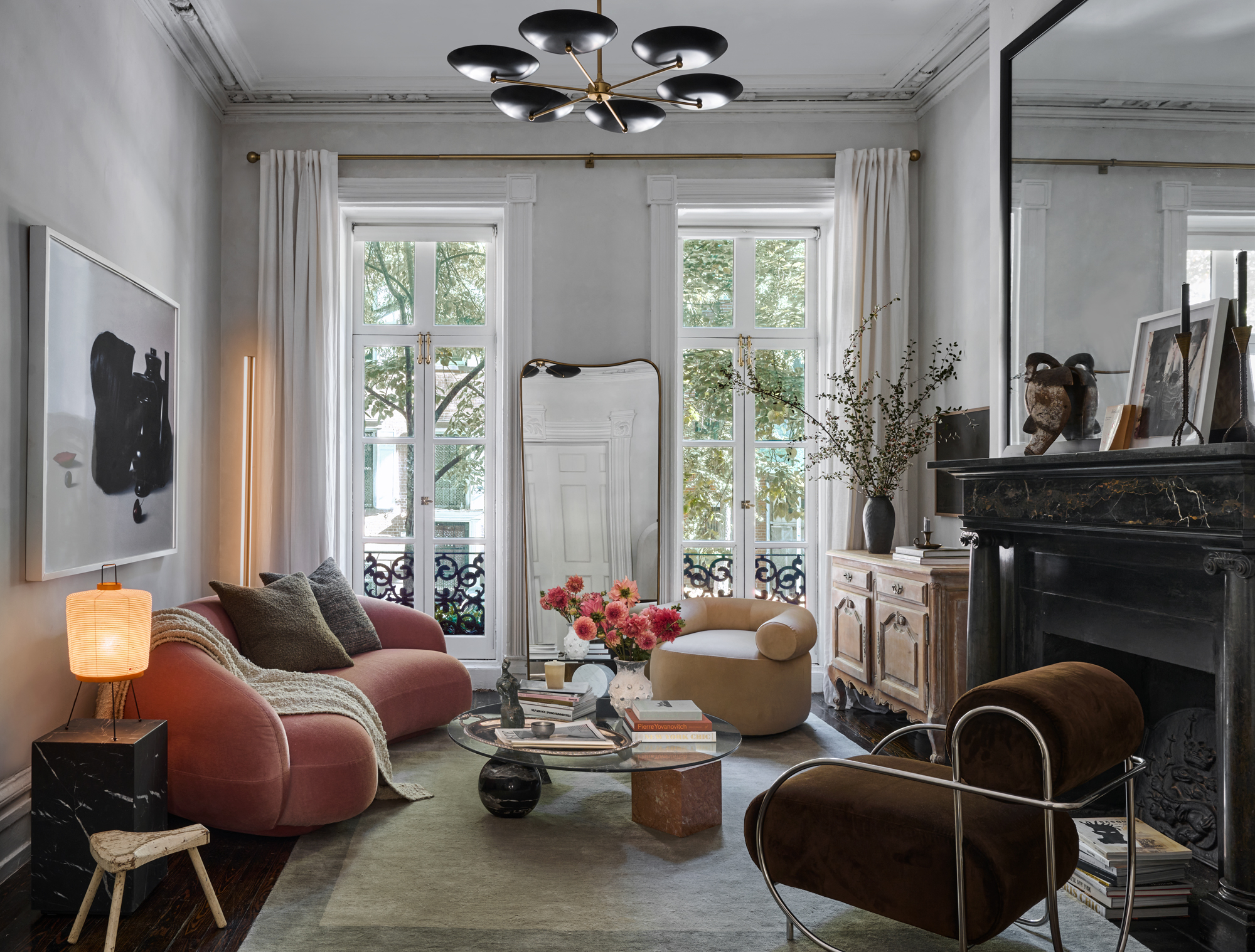 126 Washington Place, Unit 2 Manhattan, NY 10014 - Photo 2 of 14 a living room with furniture chandelier and a fireplace
