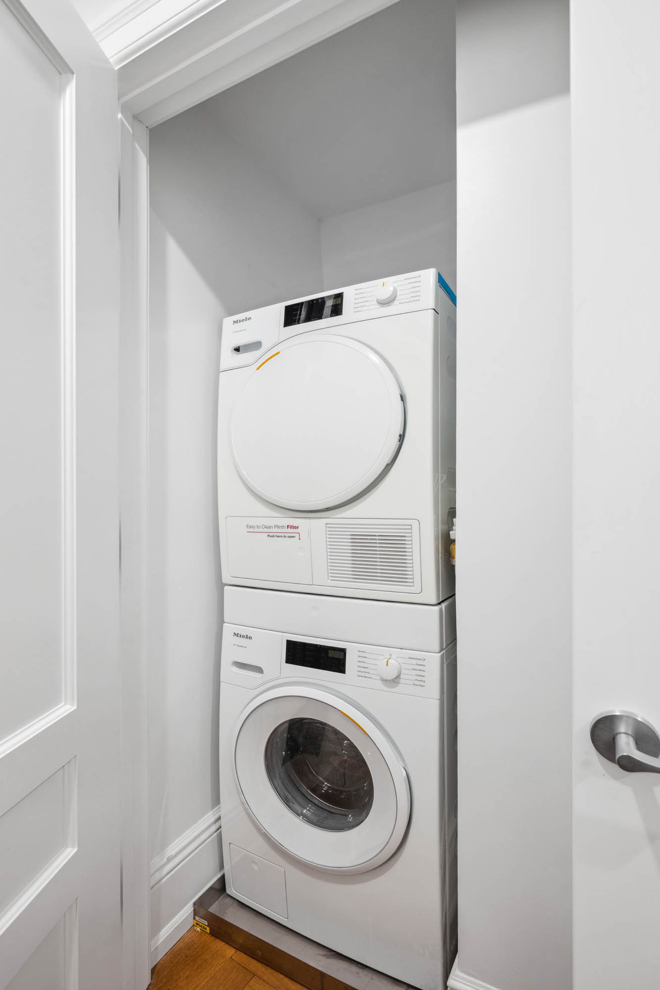 2109 Broadway, Unit 1192 Manhattan, NY 10023 - Photo 6 of 7 a utility room with dryer and washer