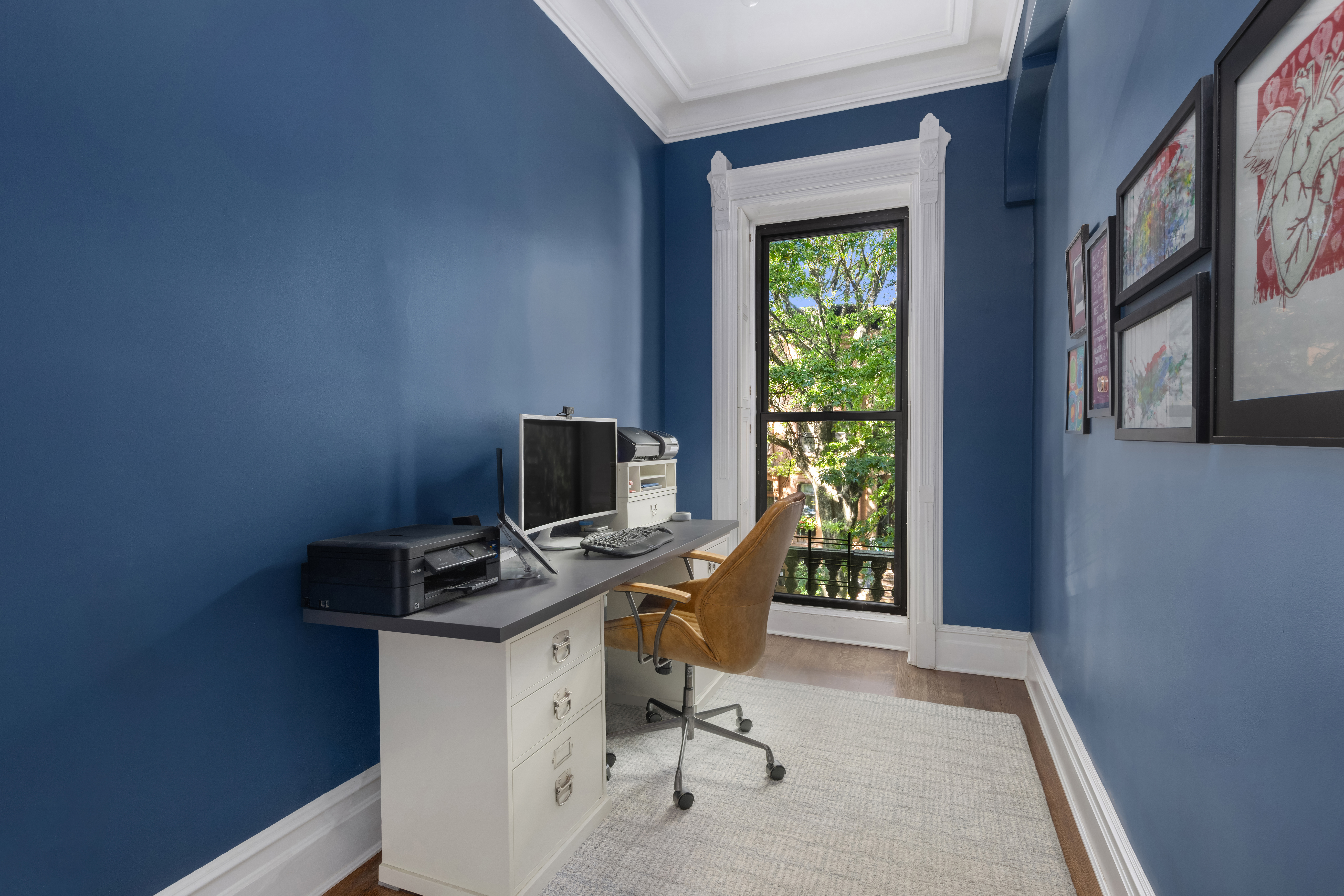159 6th Avenue, Unit TRIPLEX Brooklyn, NY 11217 - Photo 9 of 19 a view of a workspace with furniture and a window
