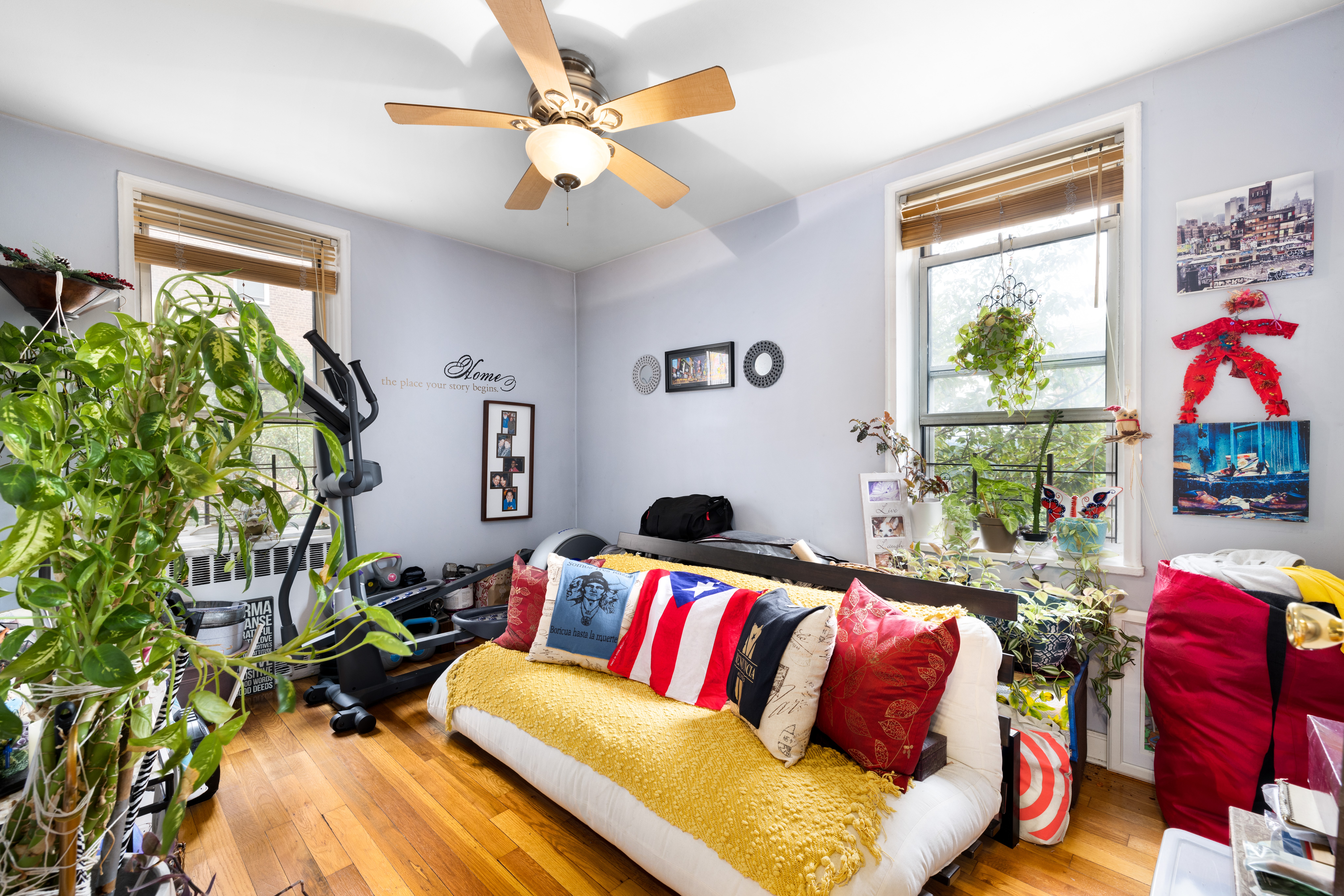 5635 Netherland Avenue, Unit 1G Bronx, NY 10471 - Photo 6 of 7 a living room with patio furniture and a potted plant
