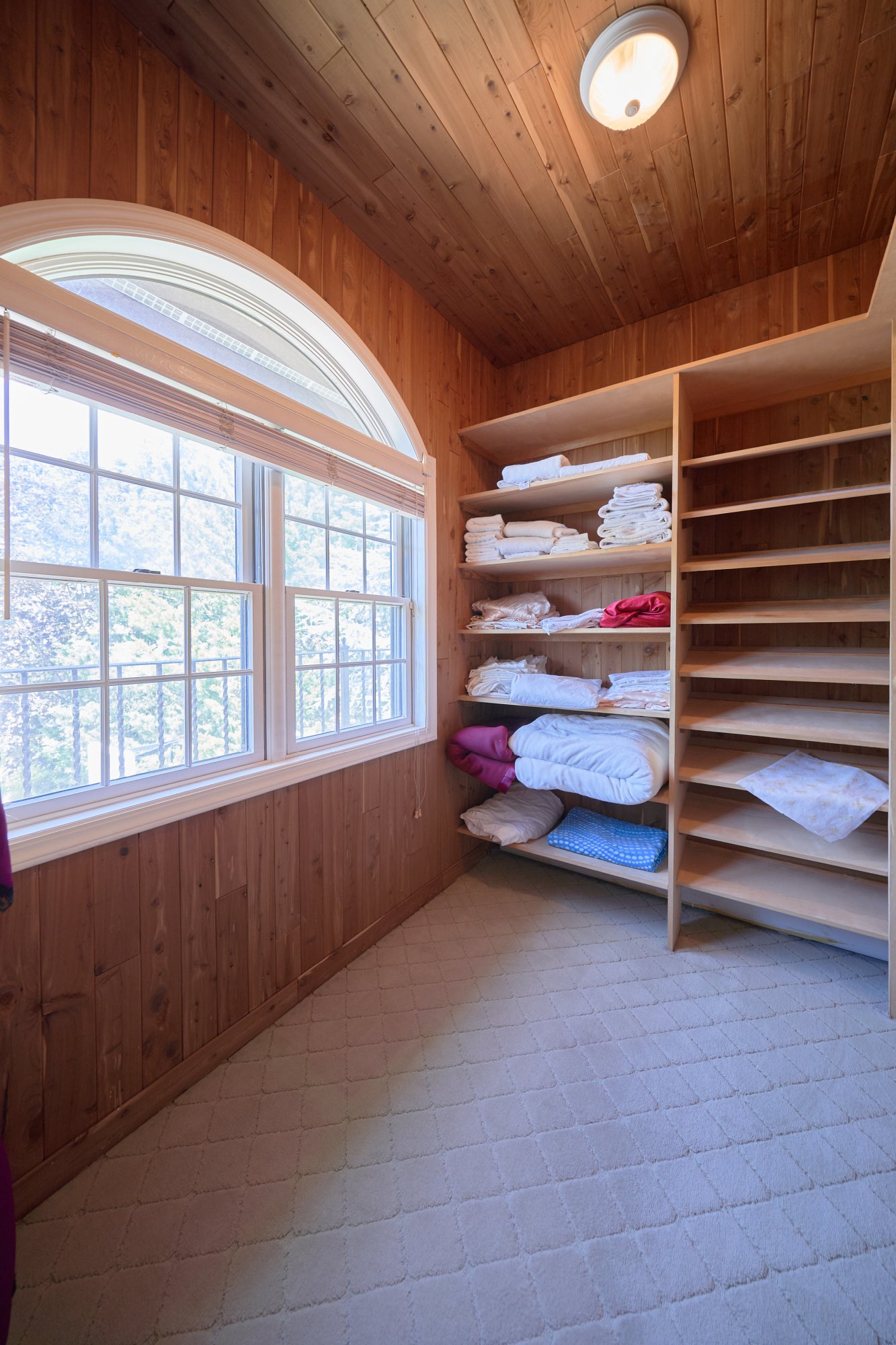 3411 Country Club Road Bronx, NY 10465 - Photo 25 of 54 a view of walk in closet with clothes and shoes