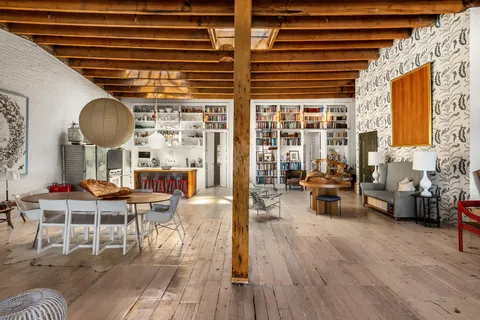 a living room with furniture and a window