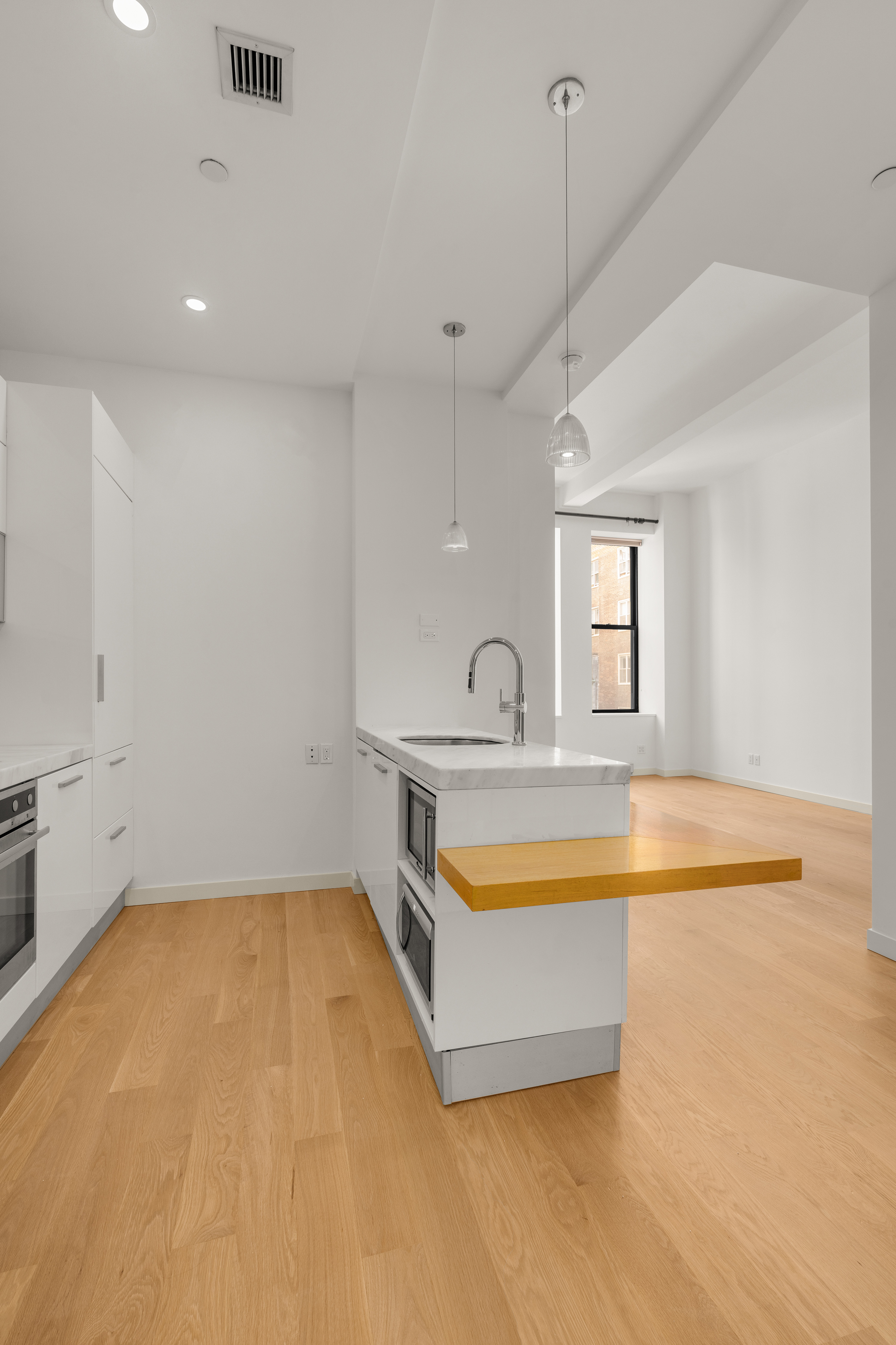 11 East 36th Street, Unit 503 Manhattan, NY 10016 - Photo 3 of 17 a spacious bathroom with a tub and chandelier