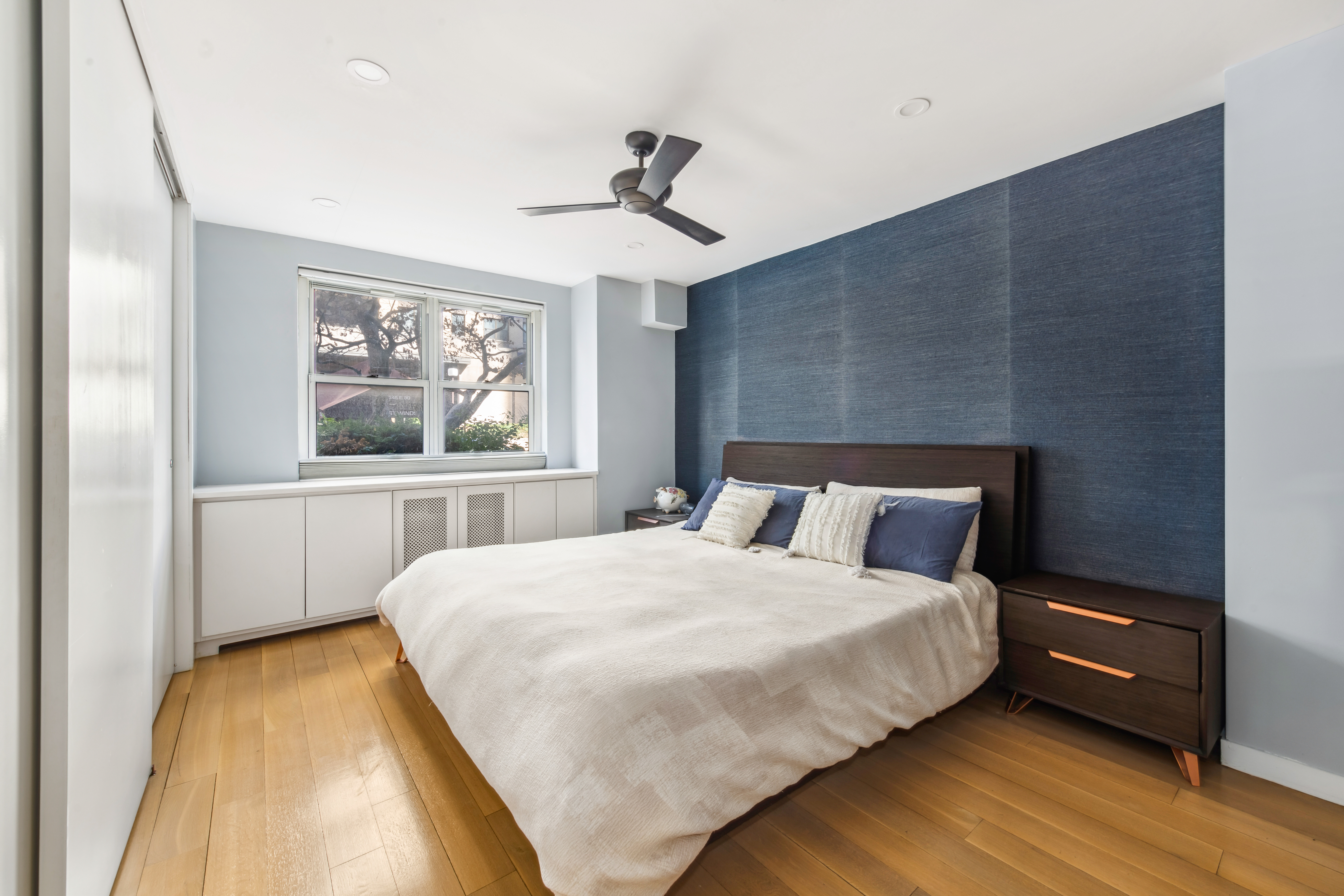 340 East 80th Street, Unit 1D Manhattan, NY 10075 - Photo 7 of 15 a bedroom with a bed and a window