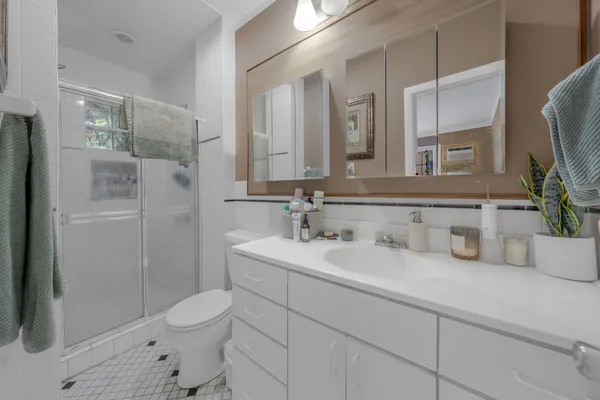 a kitchen with stainless steel appliances granite countertop a refrigerator and microwave
