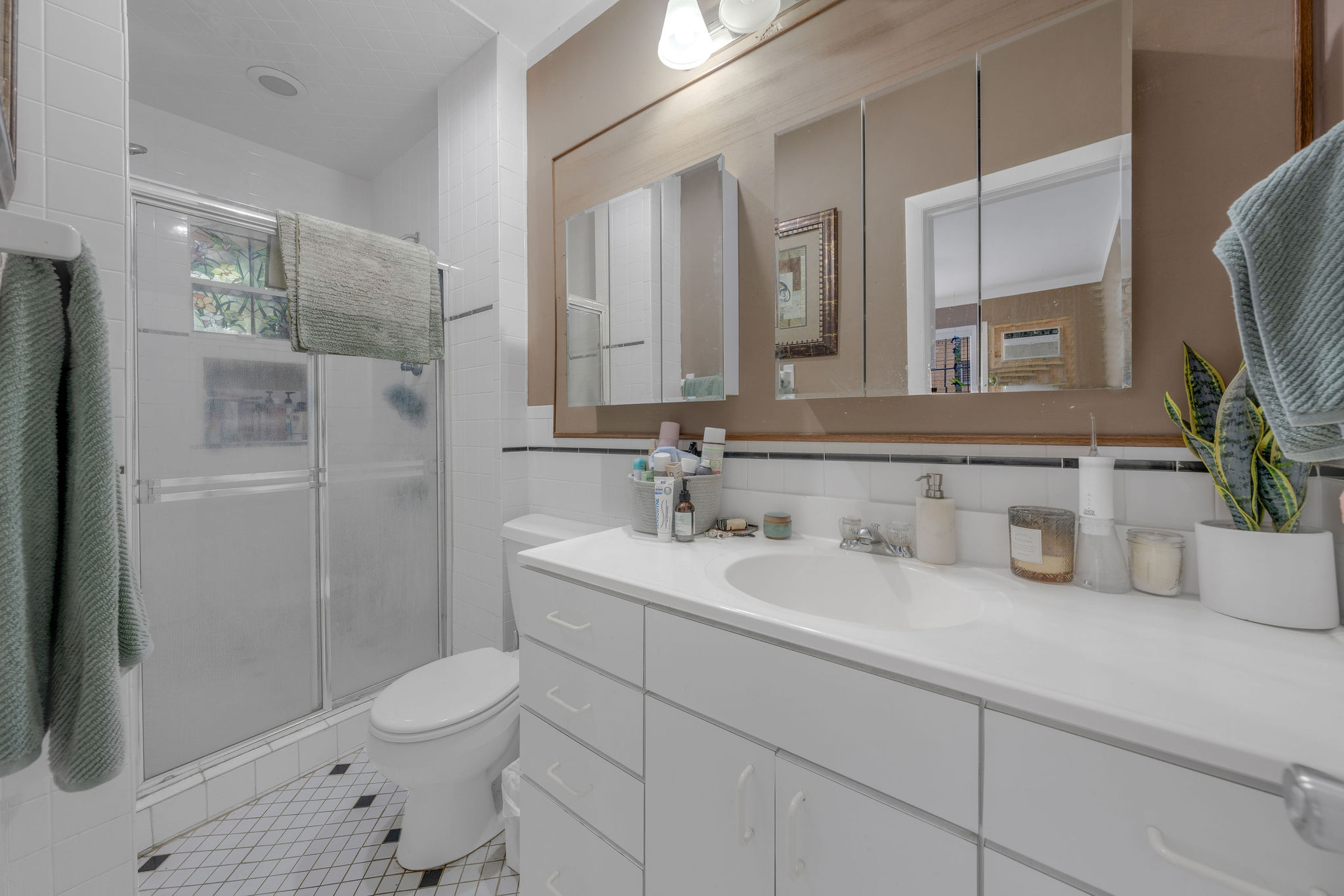 735-745 Meridian Avenue Miami Beach, FL 33139 - Photo 14 of 62 a bathroom with a toilet sink and shower