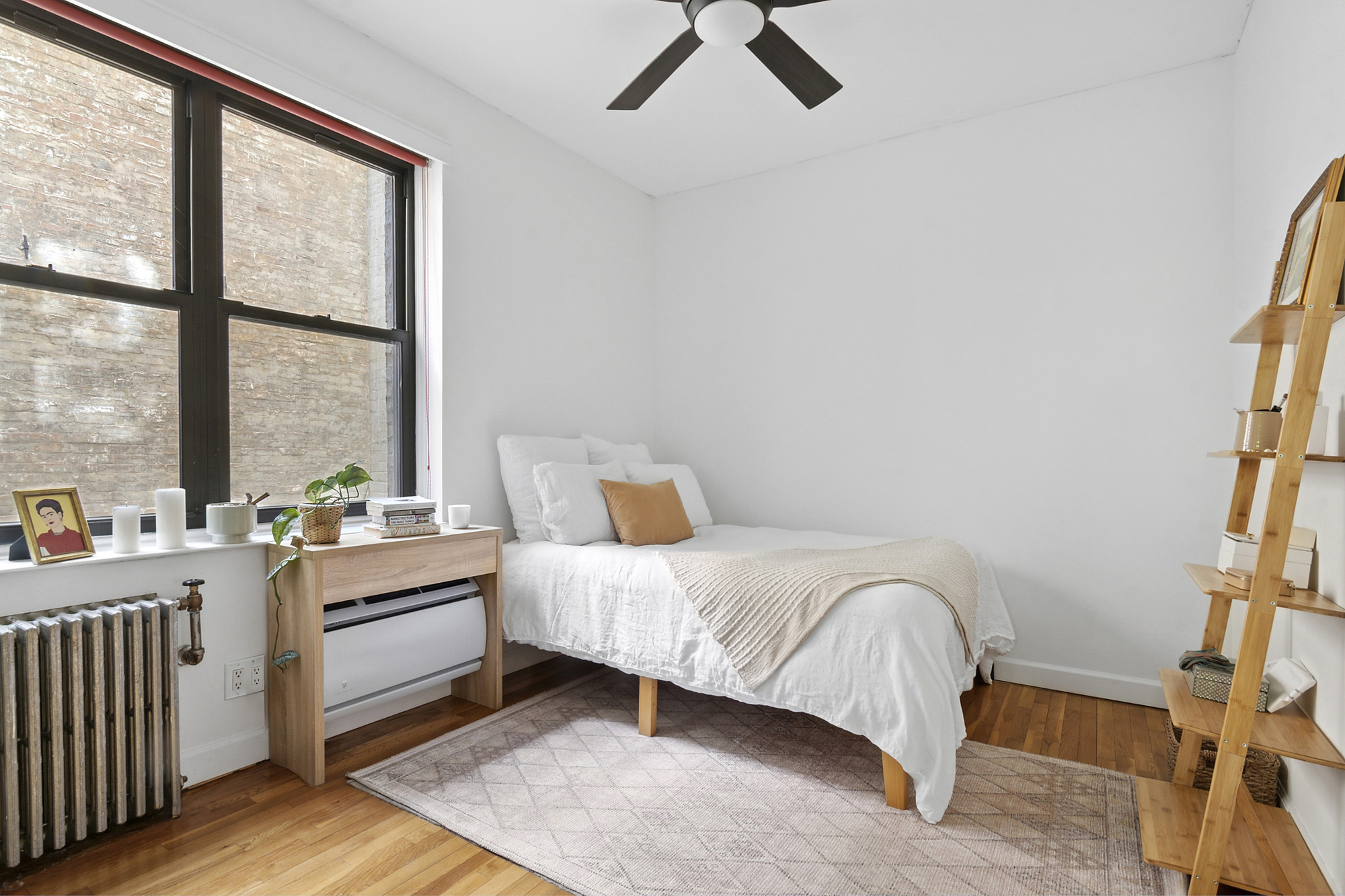 338 Prospect Place, Unit 2B Brooklyn, NY 11238 - Photo 4 of 7 a bedroom with a bed wooden floor and window