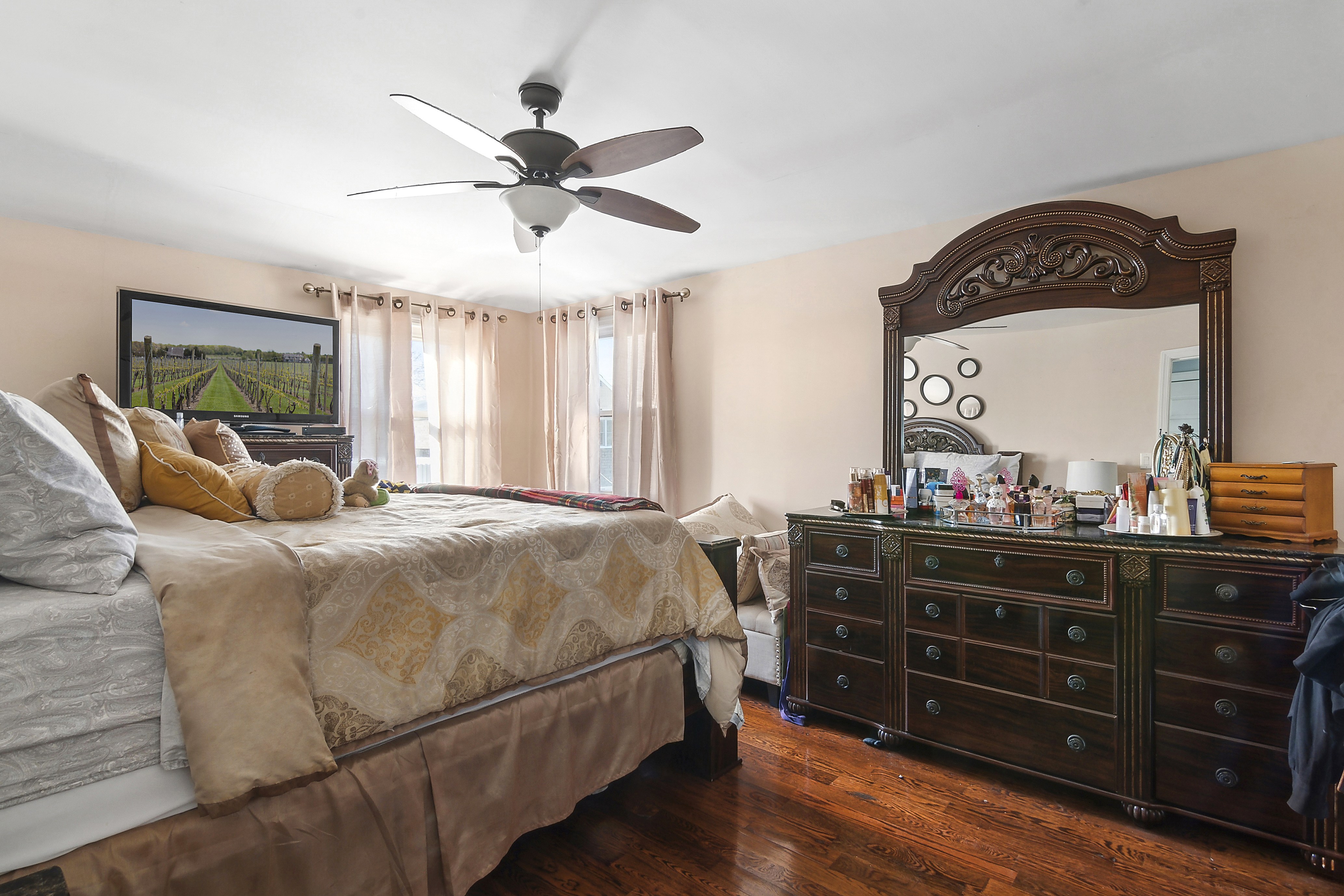 139-14 Springfield Boulevard Queens, NY 11413 - Photo 5 of 7 a bedroom with a bed and a dresser