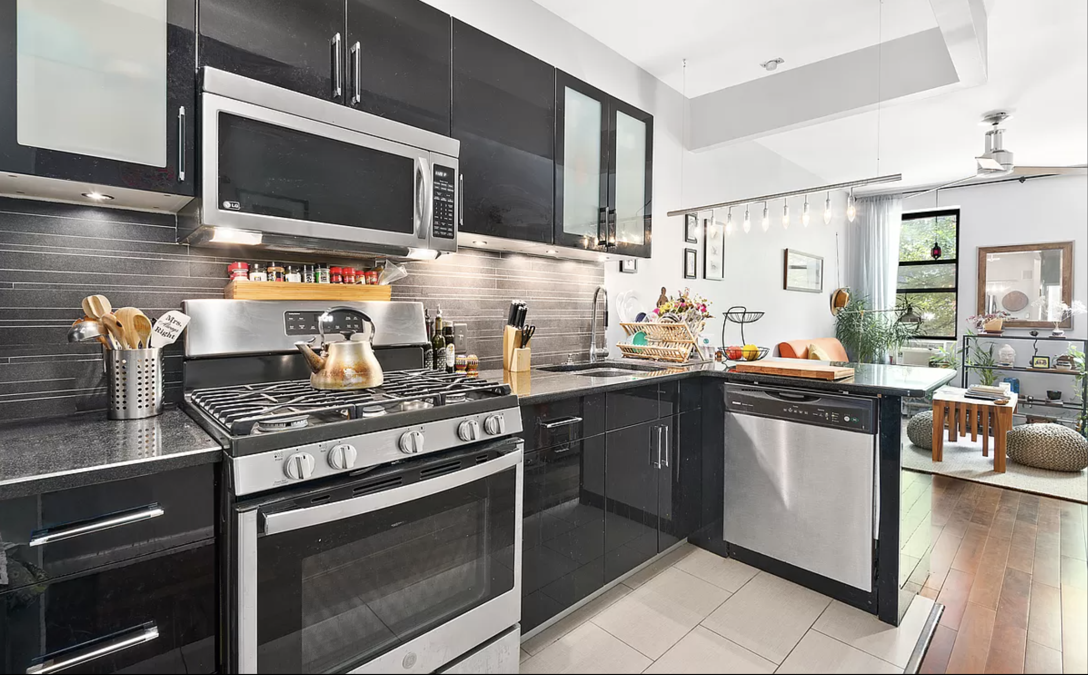 706 Sackett Street, Unit 2 Brooklyn, NY 11217 - Photo 2 of 7 a kitchen with stainless steel appliances a stove microwave and sink