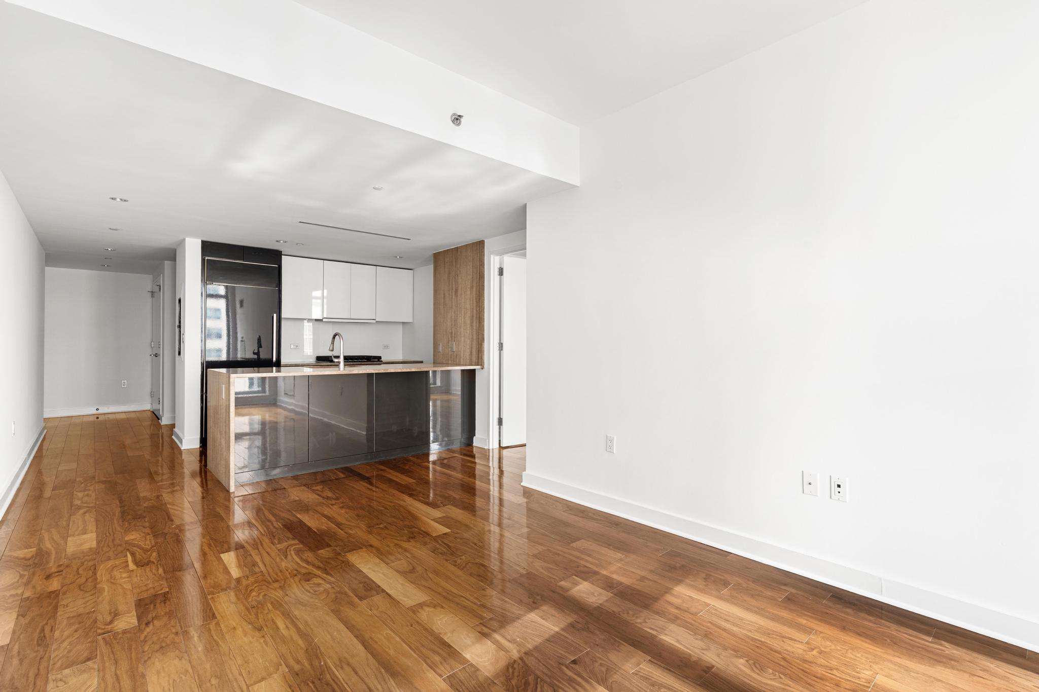 2 Northside Piers, Unit 5U Brooklyn, NY 11249 - Photo 2 of 12 a view of kitchen with wooden floor