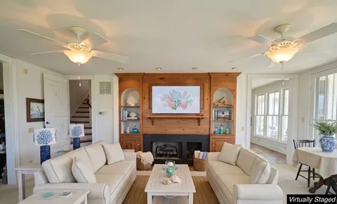 a bedroom with furniture and a window