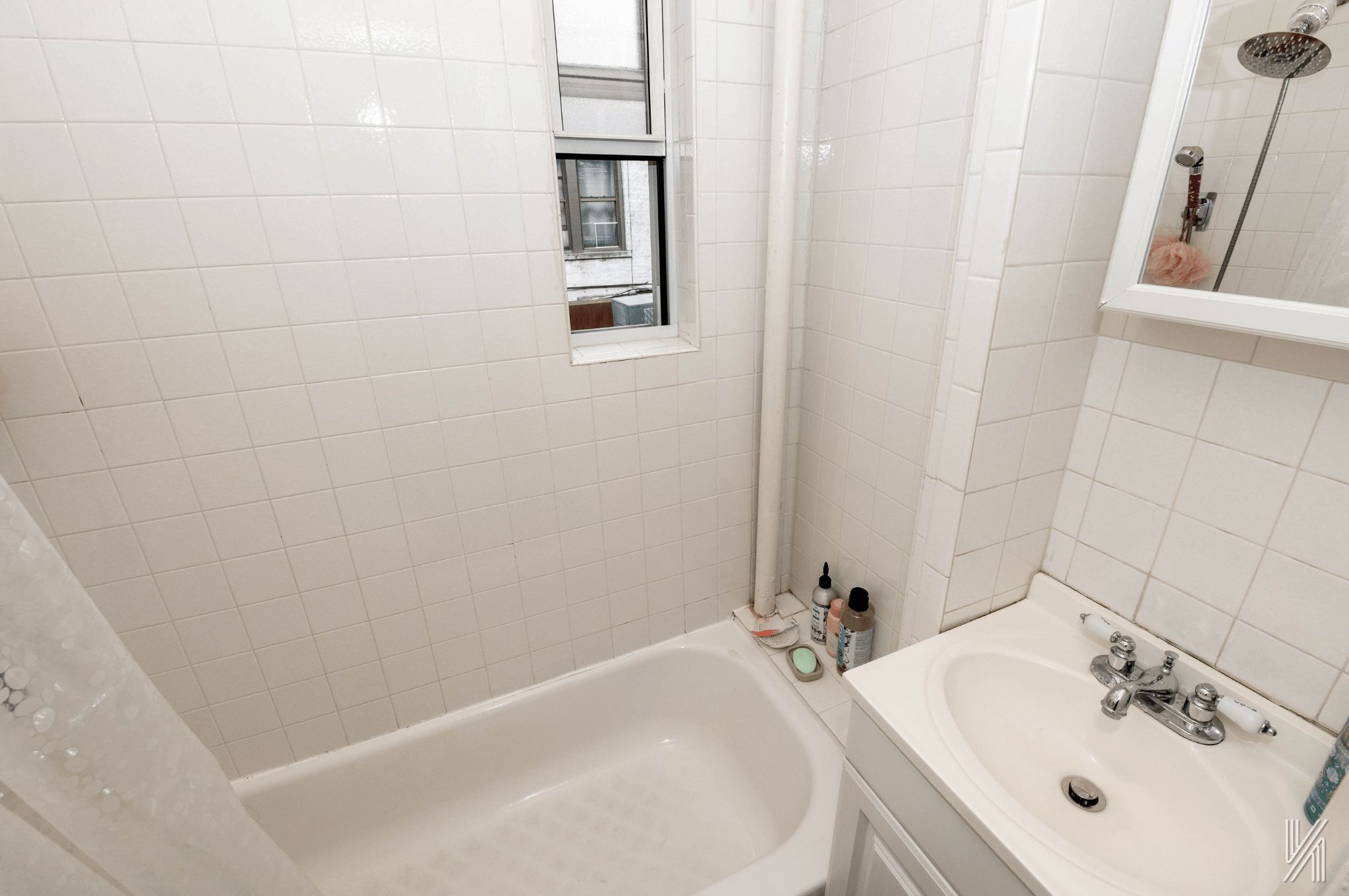 32-10 35th Street Queens, NY 11106 - Photo 22 of 29 a bathroom with a sink and a bathtub