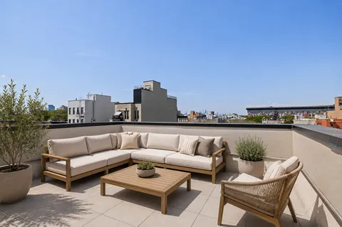 a view of a terrace with couches and a table