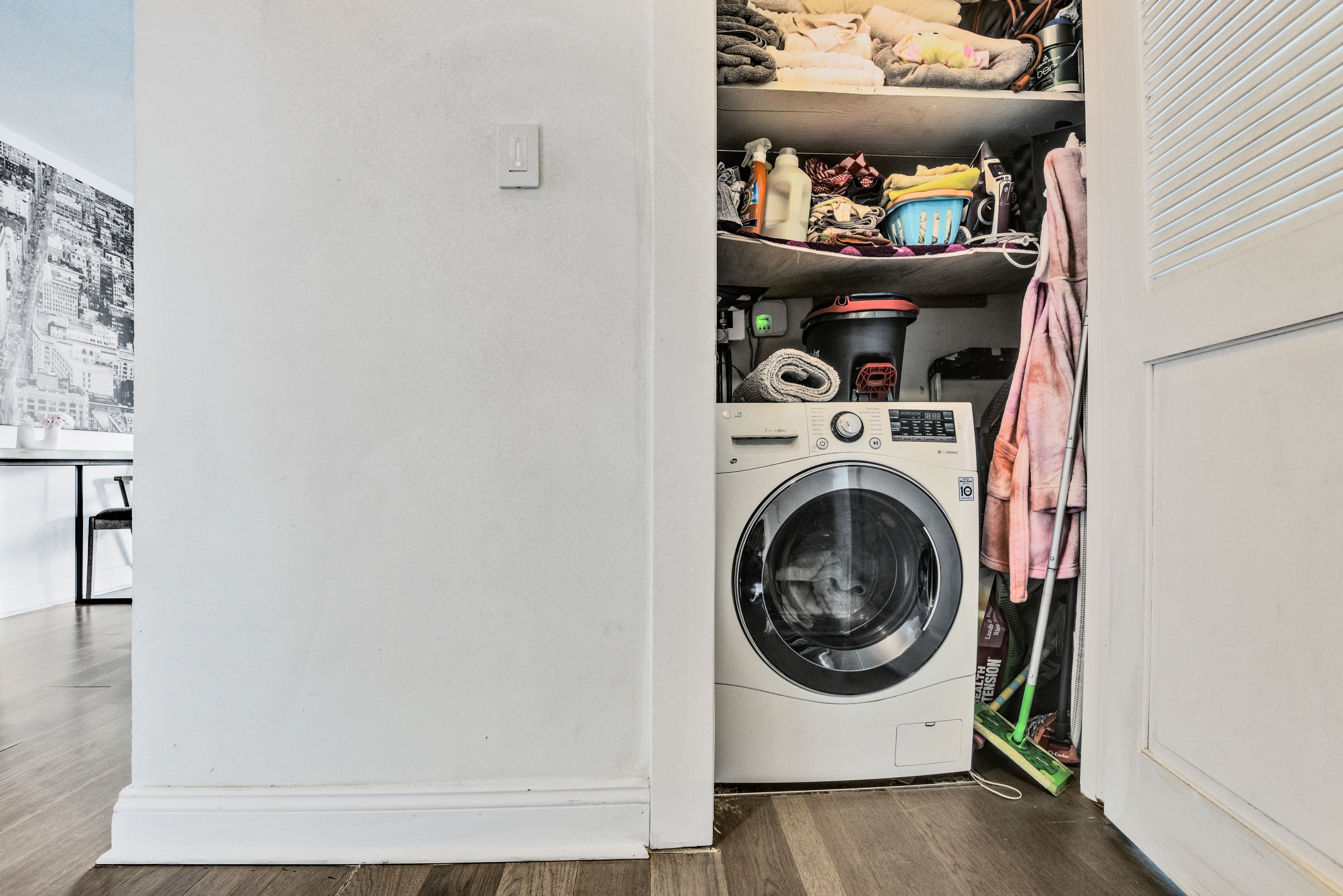 208 East Broadway, Unit J1304 Manhattan, NY 10002 - Photo 11 of 19 a utility room with dryer and washer