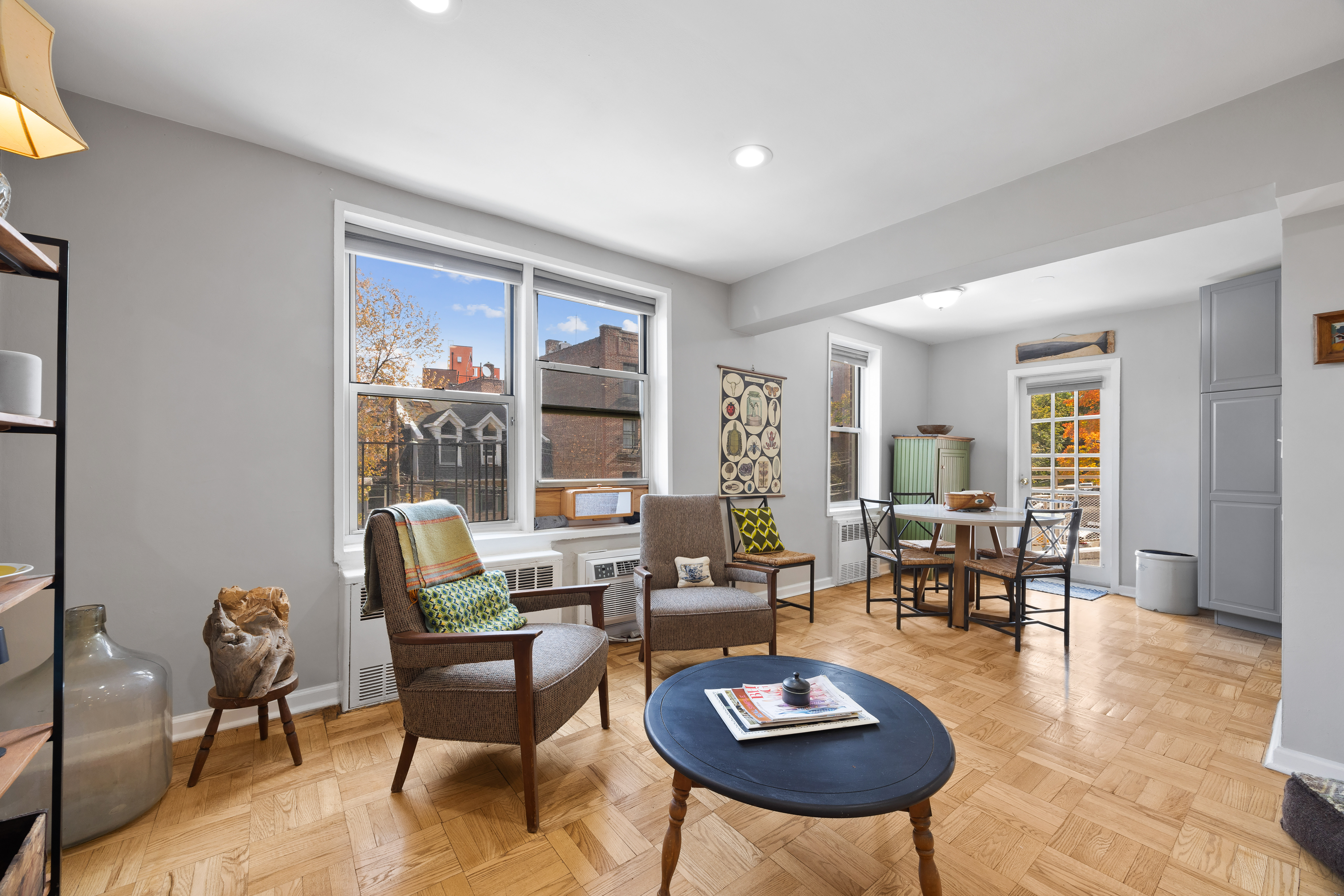 255 Fieldston Terrace, Unit 2L Bronx, NY 10471 - Photo 7 of 32 a living room with furniture wooden floor and a table
