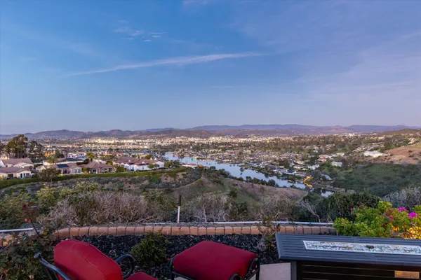 an aerial view of a house with a yard swimming pool and outdoor seating