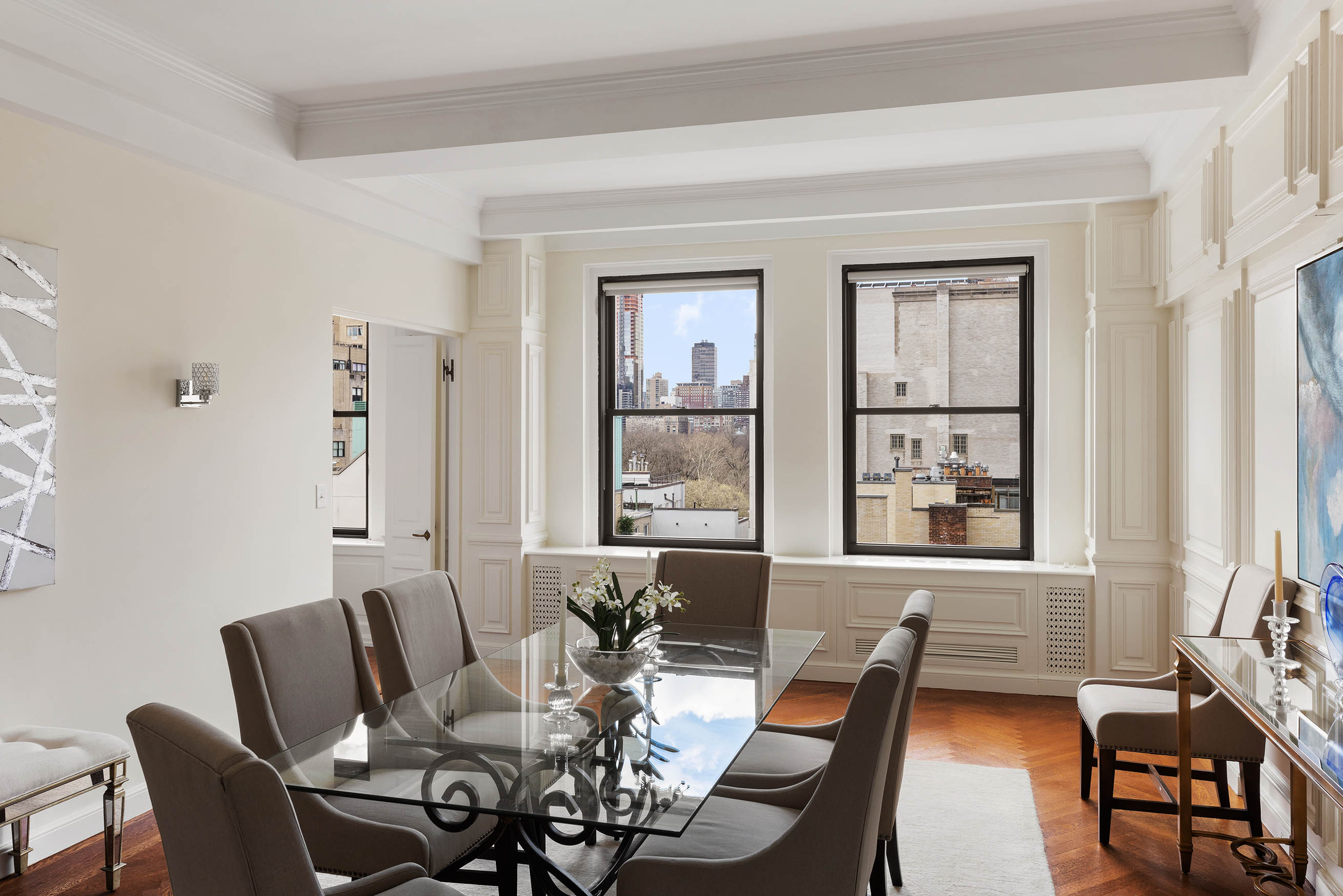 33 East 70th Street, Unit 9C Manhattan, NY 10021 - Photo 3 of 12 a view of a dining room with furniture and windows