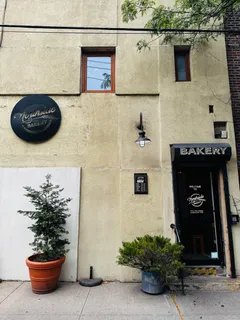 a view of a swimming pool with an outdoor seating