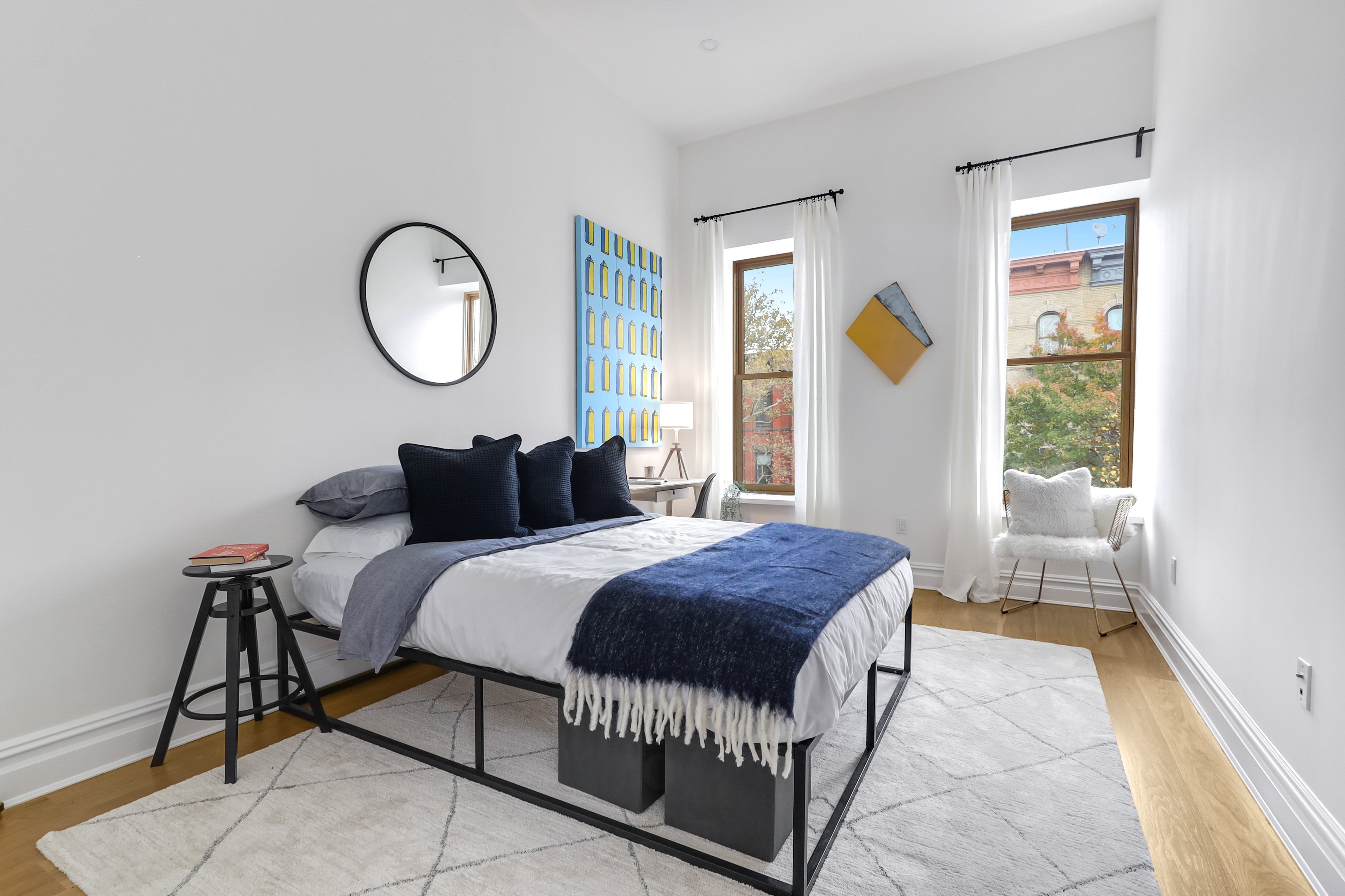 220 Lewis Avenue Brooklyn, NY 11221 - Photo 15 of 22 a bedroom with a bed and window