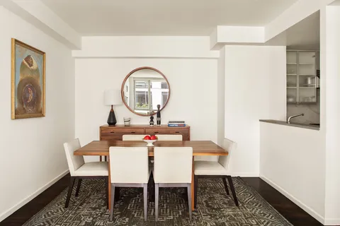 a view of a workspace with furniture