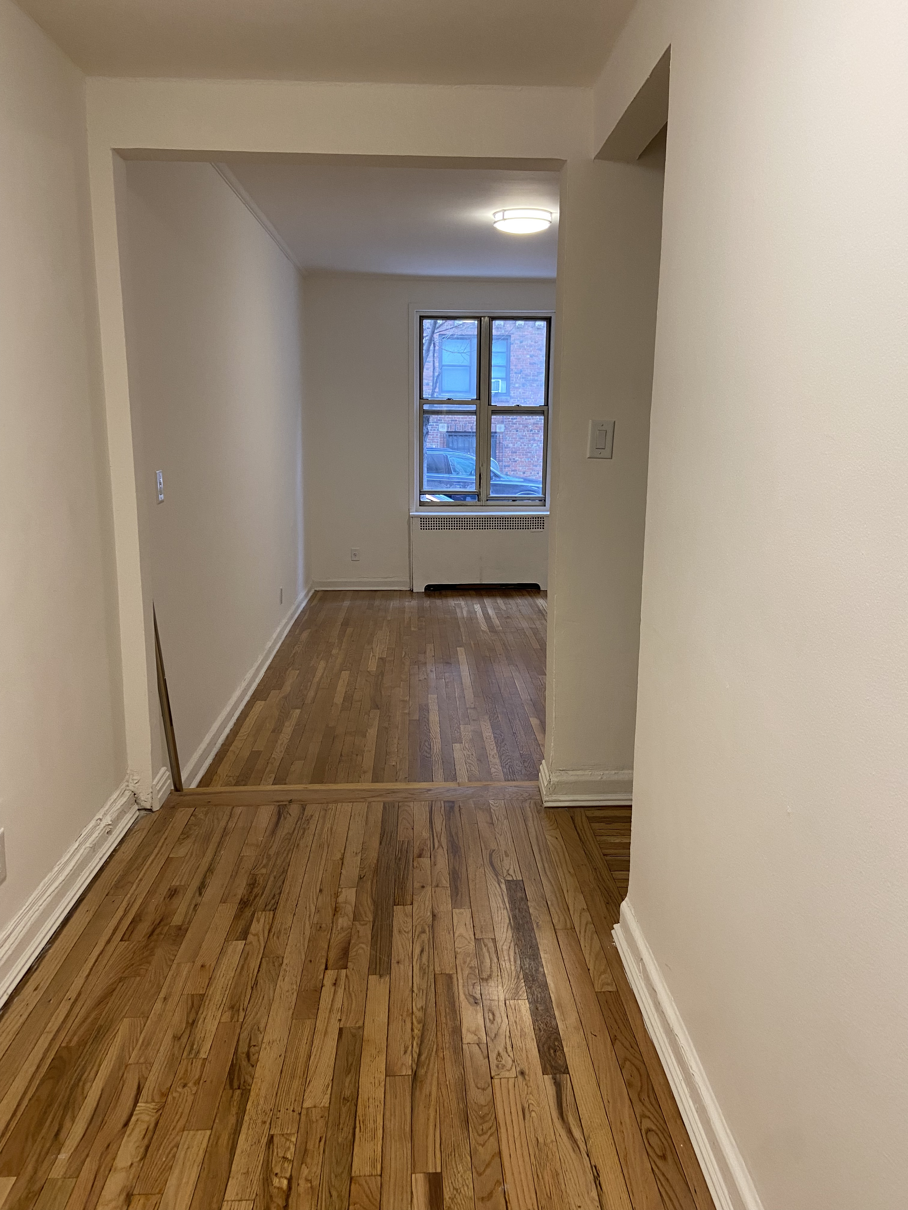 330 East 58th Street, Unit 1C Manhattan, NY 10022 - Photo 2 of 9 a view of wooden floor in a room