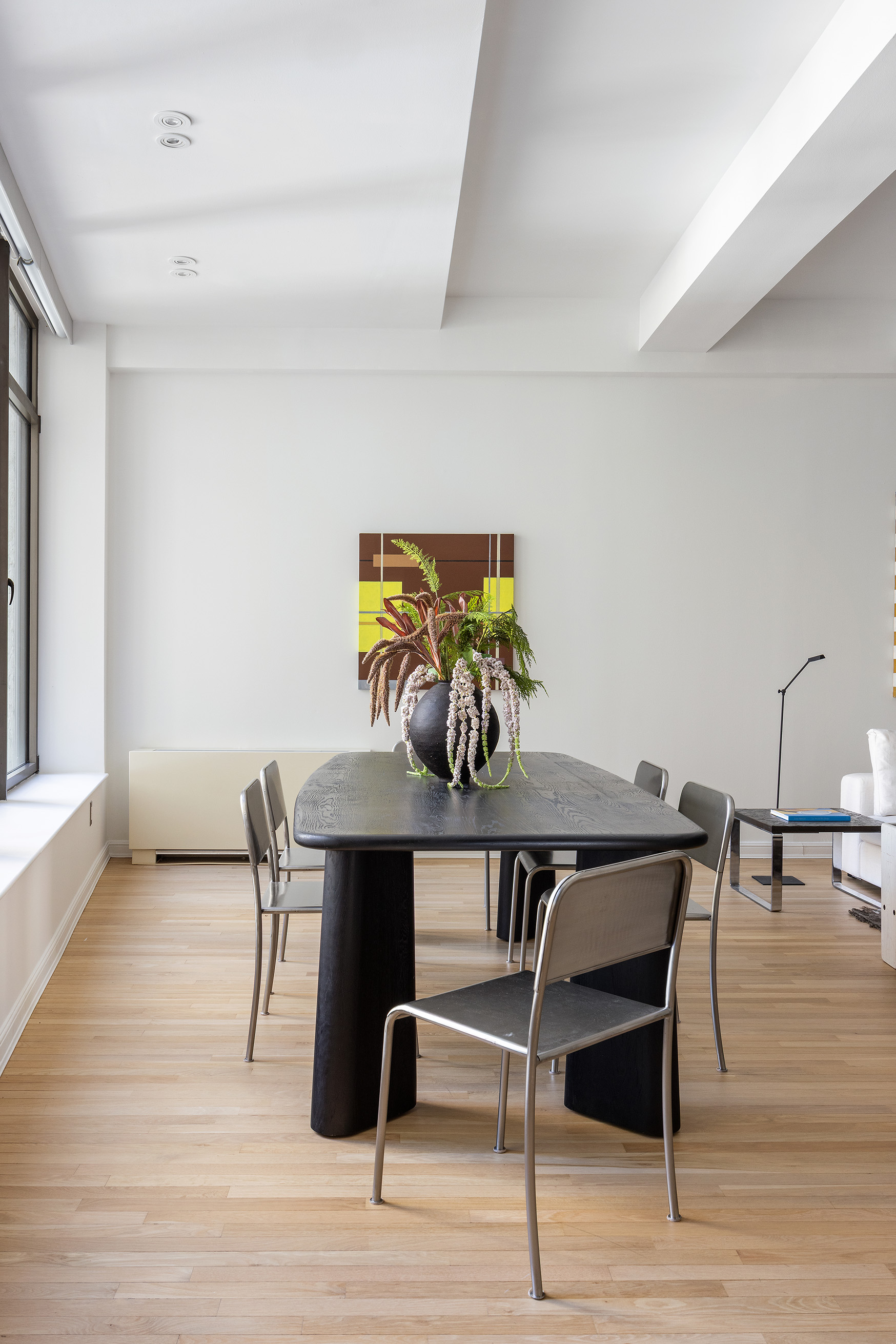 252 7th Avenue, Unit 9R Manhattan, NY 10001 - Photo 6 of 23 a view of a dining room with furniture and wooden floor