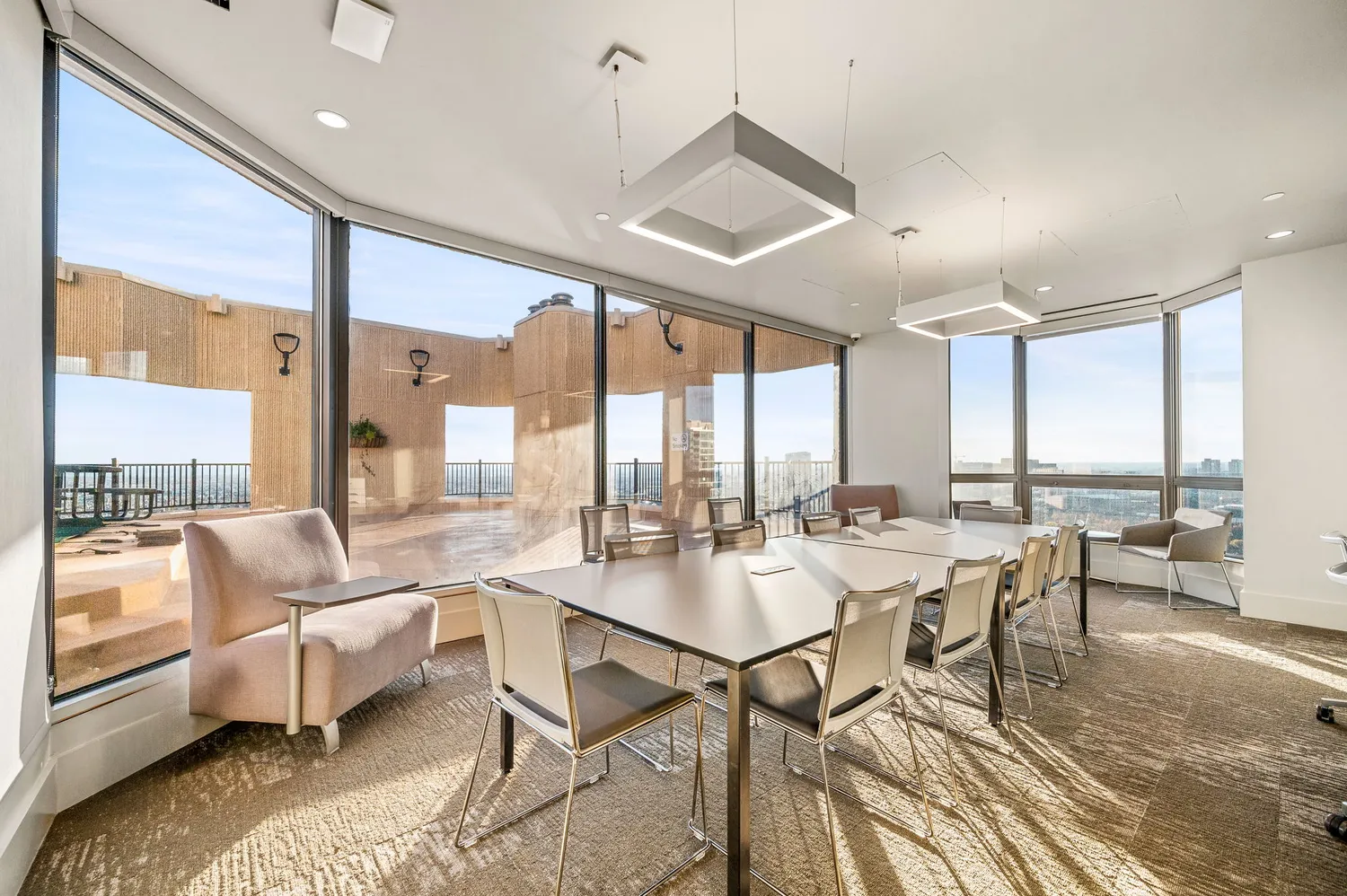 a large white kitchen with kitchen island a sink a counter space and a center island