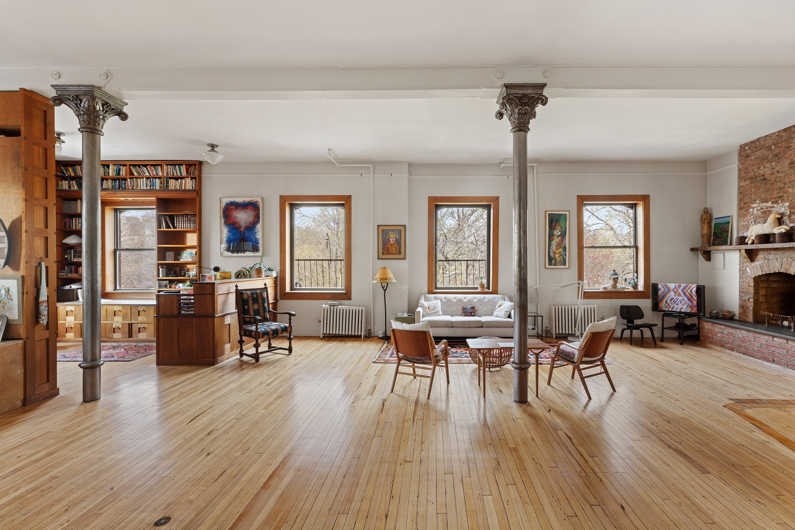 295 East 8th Street, Unit 3W Manhattan, NY 10009 - Photo 5 of 18 a living room with furniture and wooden floor