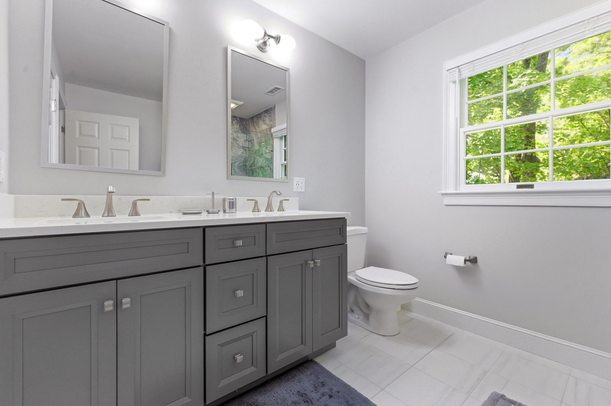 2 Laurel Street Lexington, MA 02421 - Photo 28 of 46 a bathroom with a toilet sink and mirror